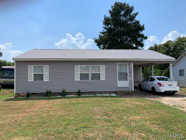 Well-maintained and updated ranch-style home offering convenient one-level living. The home features low-maintenance vinyl siding, a durable metal roof, and an attached one-car carport. The interior consists of a living room, kitchen, laundry room, three bedrooms, and two bathrooms. An added bonus is the 16' × 16' outbuilding with electricity—perfect for storage, hobbies, or a workshop. Conveniently located with easy access to the main highway. Contact us today to schedule your viewing. Property is occupied and shown by appointment only. Please do not disturb the occupants.