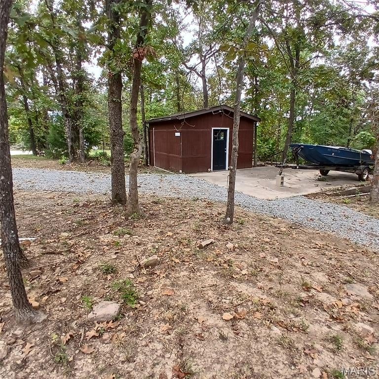 Enjoy the peaceful charm of Lake Hanna with this unique property featuring two adjoining lots, each with its own driveway for easy access and flexible use. Located just a short walk from the water, this spot is perfect for weekend getaways, camping, or future building plans.

A small building with power sits on the property—ideal for storage, a lakeside hangout, or a starter cabin setup. Outside, you’ll find a nice sitting area where you can relax, grill, or gather with friends while taking in the quiet surroundings.

This location puts you just 30 minutes from three of Missouri’s most popular state parks, giving you quick access to hiking, swimming, fishing, and endless outdoor recreation.    This property is not on the water; the pictures of the water are of the lakes you have access to!

Whether you’re looking for a retreat, a base camp for adventures, or a place to build your lake getaway, this Lake Hanna property offers convenience, flexibility, and a great setting.