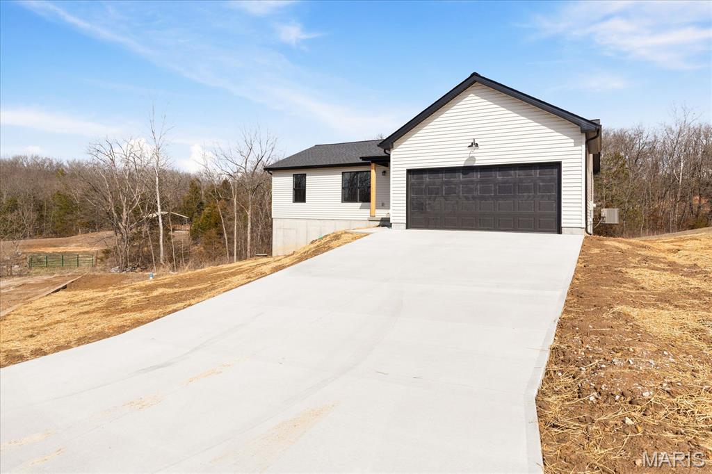 New construction without the wait! New Spec Ranch home move in ready! 1379 sq feet of living space on the main level that boasts: 3 Bedrooms 2 Full Baths, Great Room, Kitchen - Breakfast Room Combo (Granite Countertops, Walk-in Pantry, excellent Cabinet & Counter Space), and Main Floor Laundry.  LVP Flooring & Carpet throughout the main level.  Full Lower level with bath rough-in for future additonal living space. 200 amp panel. Lennox HVAC system.  Two Car Garage!