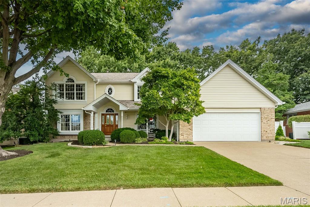 Welcome home to this beautiful, original-owner, 4-bedroom, 3.5-bath, 2-story home with great curb appeal and within walking distance of Wapelhorst Park! Dramatic 2-story foyer with living room, family room, kitchen & dining room that flow seamlessly together, perfect for hosting or for everyday living. The family room has a gas fireplace & built-ins with a work desk area. Updated kitchen features custom soft-close cabinets, quartz countertops, subway tile backsplash, Boos Block center aisle, stainless steel appliances with gas range & walk-in pantry. The half bath with large laundry room completes the main level living. The upper-level vaulted primary bedroom with ceiling fan offers a vaulted ensuite bath with walk-in closet, double-bowl vanity, jetted tub, separate shower, linen closet, and 2 skylights with plant shelf. 3 more spacious bedrooms with plenty of closet space & hall bath with skylight & linen closet. The finished lower level has a family room & rec area, sleep/craft room, bath with shower, and storage area. You will love your lush backyard with patio and 16x16 screen room to enjoy your private retreat. Oversized 2-car garage with service door & space for a workbench. Six-panel solid wood doors. Ceiling fans. Anderson windows. High-efficiency HVAC. Maintenance-free exterior w/ newer architectural shingle roof, enclosed soffits, brick front & vinyl siding. Quick access to Hwy 70 & Page Extension. Conveniently located to shops, restaurants & Bogey Hills Golf Club