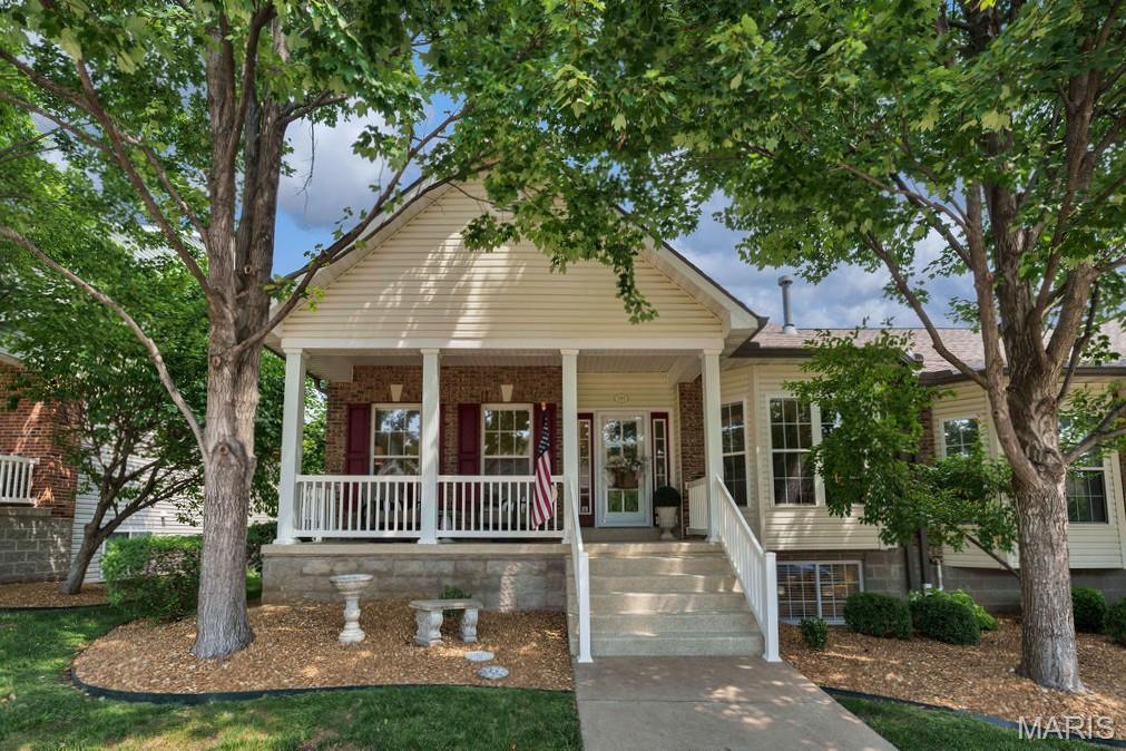 WELCOME HOME! This beautiful villa offers comfortable living, thoughtful features and a fantastic location in a great neighborhood! Attractive curb appeal welcomes you to the large, covered front porch - an inviting place to relax and enjoy the peaceful surroundings, with a recent epoxy finish adding to its appeal. Step inside to gorgeous wood floors, vaulted ceilings and a warm, neutral decor that makes this home feel instantly inviting. The spacious kitchen is perfect for both everyday meals and entertaining, offering 42” cabinets, smooth-top stove, attached microwave, dishwasher, refrigerator, under-cabinet, pendant & can lighting, large center island with breakfast bar overhang and a full pantry. The sunroom addition provides extra living space and is a wonderful spot to enjoy your morning coffee or unwind at the end of the day. The main level features 2 bedrooms, including a spacious primary suite with tray ceiling, walk-in closet and a private bath complete with 2 sinks, large shower and oval soaking tub. The 2nd bedroom offers a large closet with the doors removed for easy access and windows that fill the room with natural light. Convenient main floor laundry adds to the ease of everyday living. And there is even more downstairs! The finished lower level offers a large family room featuring a Heatilator fireplace and wet bar – perfect for entertaining, game nights or binging your favorite shows. You’ll also find the 3rd bedroom with walk-in closet and a 3rd full bath. Plus, two large unfinished rooms provide abundant storage and flexible space for hobbies, crafting, a workshop or whatever suits your needs. Don't miss the landscaped area behind the sunroom addition - it makes a nice place to enjoy nature. Additional highlights include: 9’ main-level ceilings * 6-panel doors * open spindled stairwell to the finished basement * gas fireplace in the large great room * 2-car rear-entry garage * chair lift in the garage for added convenience. What a wonderful opportunity: comfortable, spacious and thoughtfully designed, this is villa living you’ll want to experience for yourself – comes see all this home has to offer!