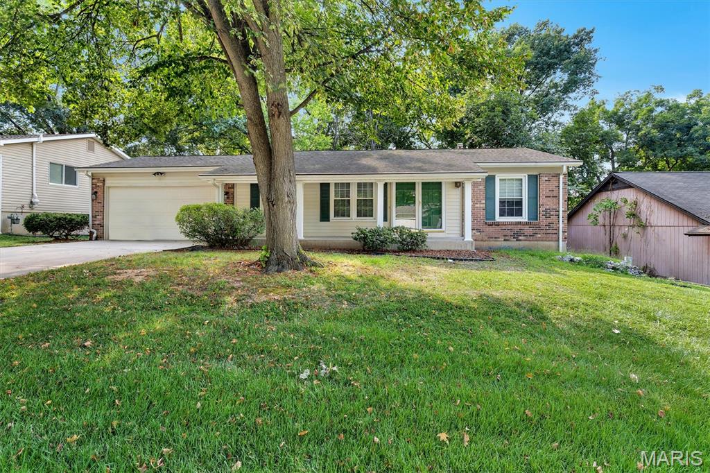 Welcome home to this beautifully maintained gem in the heart of St. Peters! This charming home offers the perfect blend of comfort, character, and thoughtful updates. Fresh new carpeting in the living room, dining room, and bedrooms creates a warm, move-in-ready feel, while the inviting family room showcases rich wood flooring and a stunning floor-to-ceiling brick fireplace that serves as the centerpiece of the home.

The bright and functional kitchen features beautiful cherry cabinetry, generous counter space, and an abundance of natural light, making it ideal for both everyday living and entertaining.

Step outside to your own private retreat a spacious, shaded deck overlooking mature trees and common ground, providing the perfect setting for morning coffee, summer barbecues, or relaxing evenings with family and friends.

The finished walk-out basement provides includes an additional 732sf of finished living space, a versatile blank slate ready for your personal touch. Whether you envision a media room, game room, home gym, playroom, or additional family room, this expansive space offers endless possibilities for entertaining and everyday living.

Additional highlights include two partially updated bathrooms, a charming brick walkway that enhances the home's curb appeal, and a walk-out basement that adds valuable living space and flexibility.

Conveniently located near parks, shopping, dining, and major highways, this St. Peters home is one you won't want to miss. Schedule your private showing today!