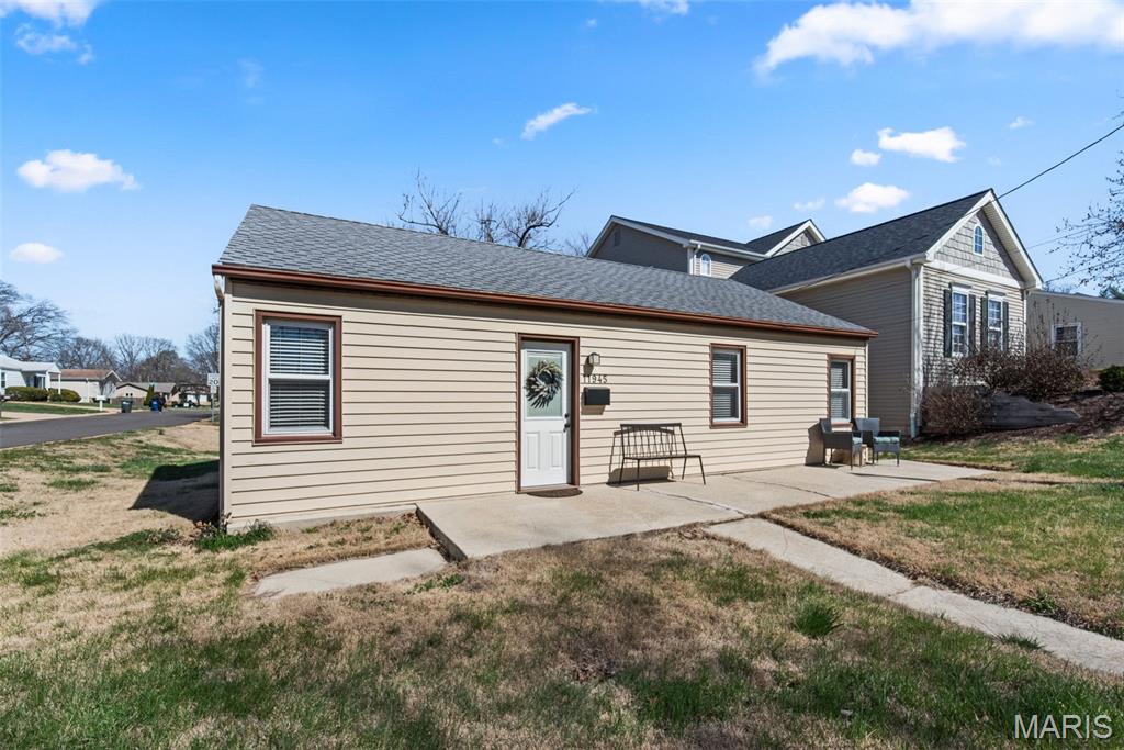 Welcome home to 11945 Lillian Avenue ... 3 bed, 1 bath home with so much potential! From the moment you enter you'll feel the cottage vibes and begin actively envisioning how to make these spaces work for you. A patio at the front greets you as you step inside to the living room with a wooden plank ceiling that's open to the light, bright kitchen with white cabinets, a double farmhouse sink, and quartz counter tops. The primary bedroom has a large, walk-in closet, while the other two bedrooms give you options for guests or a growing family. The laundry is housed in the bathroom. From the kitchen, there's a door that leads to the back yard and the over-sized 2 garage which also has the capacity to double as a workshop, gym, or just extra storage. This home is proof that you can have it all in a small footprint. Plus, it's in a great location! Close to Pioneer Park and all the shopping and restaurants in the Manchester Road corridor. Don't miss this one!! Whether it's your first home or your next home, it's a fantastic find for anyone who appreciates modern updates and a cozy, efficient layout!