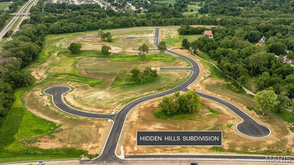 WONDERFUL CUL-DE-SAC LOCATION!    Nestled within the picturesque new development of Hidden Hills in Glen Carbon, IL, this spacious residential lot offers the perfect opportunity to build your dream home in a vibrant and growing community. Surrounded by gently rolling terrain and a beautifully planned neighborhood design, the lot provides wonderful accessibility. Enjoy the perks of easy access to major highways, making commutes to St. Louis and surrounding areas convenient. Hidden Hills is part of the Edwardsville District 7 schools and is nearby healthcare, and essential amenities. MCT Bike Trail access within the neighborhood- perfect for the outdoor enthusiast.  All this, and it’s close to Schon Park, downtown Glen Carbon & Edwardsville amenities such as shopping & restaurants. Bring your builder and bring your plans.  Spectrum available, AT&T anticipated soon!.  All plans subject to Architectural Control Committee.  Additional lots available, too- Ask your favorite agent for additional information.  Listing agents have an agent Interest.