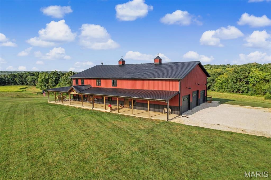 Private 43-Acre Estate with Custom Barndominium, Shop & Unlimited Potential

Discover the perfect blend of luxury, privacy, and recreation on this exceptional 43-acre property in Lincoln County, located within the highly sought-after Troy School District.

The custom-built 3-bedroom, 2.5-bath barndominium offers approximately 3,200 square feet of beautifully designed living space, complete with a spacious loft and a stunning wood-burning fireplace that serves as the centerpiece of the home. A 2,250-square-foot unfinished walkout basement provides endless possibilities for expansion, already featuring rough-ins for future finishes and a reinforced 6’ x 8’ concrete safe room.

Outside, you’ll find a 42’ x 72’ shop with concrete floors, a full insulated bathroom with washer and dryer hookups, a wood-burning stove, and a 12-foot lean-to, making it ideal for equipment storage, hobbies, or running a business from home. The property is serviced by a private well and features a wet-weather creek that adds character and wildlife appeal.

Conveniently located just 12 minutes from Troy, 15 minutes from Interstate 70, and approximately 30 minutes from Wentzville, this property offers peaceful country living without sacrificing accessibility.

Nature enthusiasts will appreciate the outstanding recreational opportunities. Multiple locations are perfectly suited for food plots to attract deer and turkey, while open fields provide excellent opportunities to plant sunflowers or milo for dove hunting. The area is well known for producing quality whitetail bucks with strong genetics and relatively low pressure. There have been multiple sightings of 170+ inch white tail on the property. 

The land also offers excellent potential for horses or cattle, with ample open ground and gently rolling terrain well-suited for pasture use, riding space, or small-scale livestock operations.

For those dreaming of creating a private waterfront oasis, the property also offers an outstanding location for a future 2- to 3+ acre lake.

Whether you’re looking for a forever home, a recreational property, or a legacy estate, this one-of-a-kind offering delivers a rare combination of comfort, functionality, and exceptional outdoor opportunity.