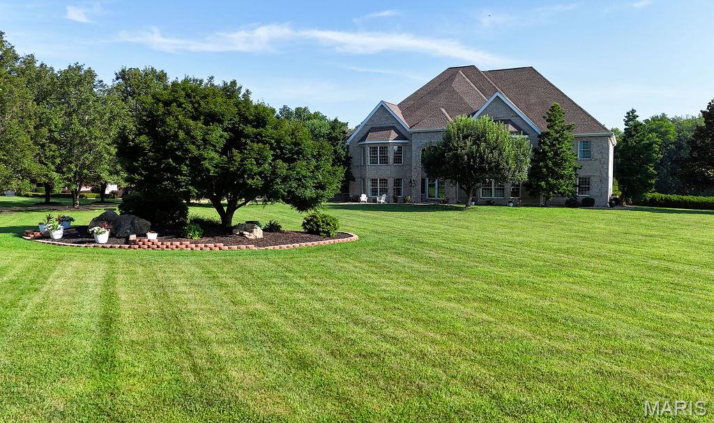 Exquisite 10,000+ sq ft Luxury Estate on 3 acres.  Discover unparalleled elegance in this stunning 5 bedroom 3 full baths, (2)- 1/2 baths , two story masterpiece, sprawling over 10.000 sq ft of meticulously crafted living space. Situated on 3 pristine acres, this home is a sanctuary of sophistication and comfort. Open concept living area flows to the second floor, showcasing breathtaking views and custom hardwood flooring. Relax in the in ground swimming pool, entertain on the covered patio. A charming gazebo adds a touch of fun! Detached 60x40 garage, climate controlled, with a bathroom, perfect for workshop plus a 24x48 carport ideal for RV parking or additional vehicles. Five generously sized bedrooms offer privacy and luxury for family or guests. Back up generators offer peace of mind.  Perfect for entertaining or family living. Every detail has been thoughtfully designed. Are you a golfer? Golf cart paths lead to 2 neighboring courses !!