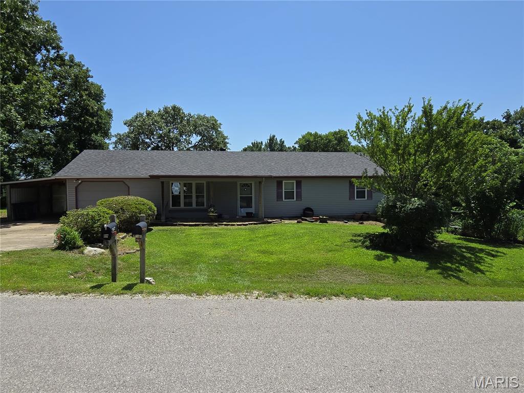Welcome home to this charming single-family residence, built in 1990 and ready for its next owners! Situated on a spacious corner lot with approximately ±0.41 acres, this property offers a fully fenced backyard with plenty of room to relax, entertain, garden, or let children and pets play. Located in the highly sought-after Waynesville R-VI School District, this home combines comfort, convenience, and a desirable location.  Inside, you'll find 3 comfortable bedrooms, 2 full bathrooms, and a versatile den/bonus room that can easily serve as a home office, playroom, hobby space, media room, or guest space to fit your lifestyle. The functional layout is perfect for families, first-time buyers, or anyone looking for a home with flexible living space.  This home also features several valuable updates, including a newer roof and a recently upgraded security system, providing added peace of mind. Outside, you'll appreciate the convenience of two storage sheds, offering plenty of room for lawn equipment, tools, seasonal décor, or additional storage.  The inviting living areas provide the perfect setting for everyday living and making lasting memories, while the spacious bedrooms offer a peaceful retreat at the end of the day. Whether you're enjoying a quiet morning with a cup of coffee, hosting family and friends, or adding your own personal touches over time, this home offers comfort, functionality, and room to grow.  The generous ±0.41-acre corner lot provides ample outdoor space to enjoy, and the fully fenced backyard is ideal for pets, gardening, outdoor entertaining, or simply relaxing after a long day.  Whether you're searching for your first home, your forever home, or your next investment, this property is one you won't want to miss. Schedule your private showing today and discover everything this wonderful home has to offer!
