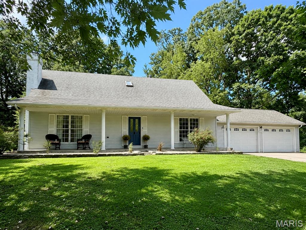 Pull into 1106 County Road 335 and the first thing you notice is the setting: mature trees, just over an acre to call your own, and a creek tracing the edge of the backyard. It feels tucked away, but you’re still only minutes from Jackson.

Inside, the updates give the home a fresh, comfortable feel without stripping away its character. Exposed beams frame the kitchen, where a large center island, breakfast bar, stainless appliances, pantry storage, and plenty of workspace make it easy to picture Saturday pancakes, homework at the island, or friends gathered around while dinner comes together. The sellers have taken care of the major updates and are leaving one choice to the next owner: **a $5,000 countertop allowance so you can pick the look you want.**

Just off the kitchen, the dining room looks out toward the trees, while the breakfast area opens to the screened porch. From there, step onto the wraparound deck, head down to the patio, or simply sit and listen to the sounds of nature. There is also a separate cleared area with room for the shop, pool, or garden you've been wishing for.

The living room centers around a stacked-stone gas fireplace, giving the main level a warm place to settle in at the end of the day. The primary bedroom, full bath, and laundry are all on the main floor. Upstairs are two more bedrooms, another full bath, and a flexible space that could become an office, playroom, reading area, or whatever fits your life best.

Downstairs, the full walk-out basement already includes a half bath and offers a large amount of open space for whatever comes next. Finish it as a rec room, theater, gym, workshop, guest area, or additional living space—or leave it wide open.

With 2,319 finished square feet, 3 bedrooms, 2.5 baths, multiple outdoor living areas, room to expand, and a wooded creekside backdrop, this is the kind of place where it’s easy to picture settling in and staying awhile.