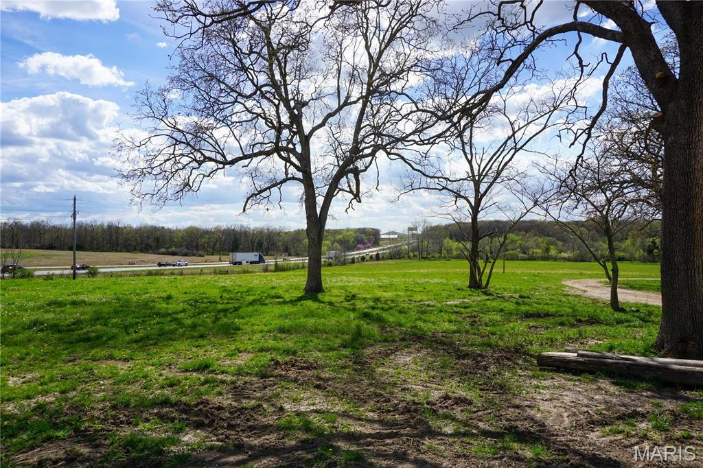 This expansive property boasts approximately 32.52 m/l acres of picturesque pastureland, accompanied by over 2,000 feet of frontage along the prominent I-44. Featuring a well and a sturdy metal shop building, this parcel presents an ideal canvas for various endeavors. Whether envisioned as a stunning residential retreat, a recreational haven, or a prime development opportunity, its unparalleled visibility from the bustling I-44 ensures limitless potential.