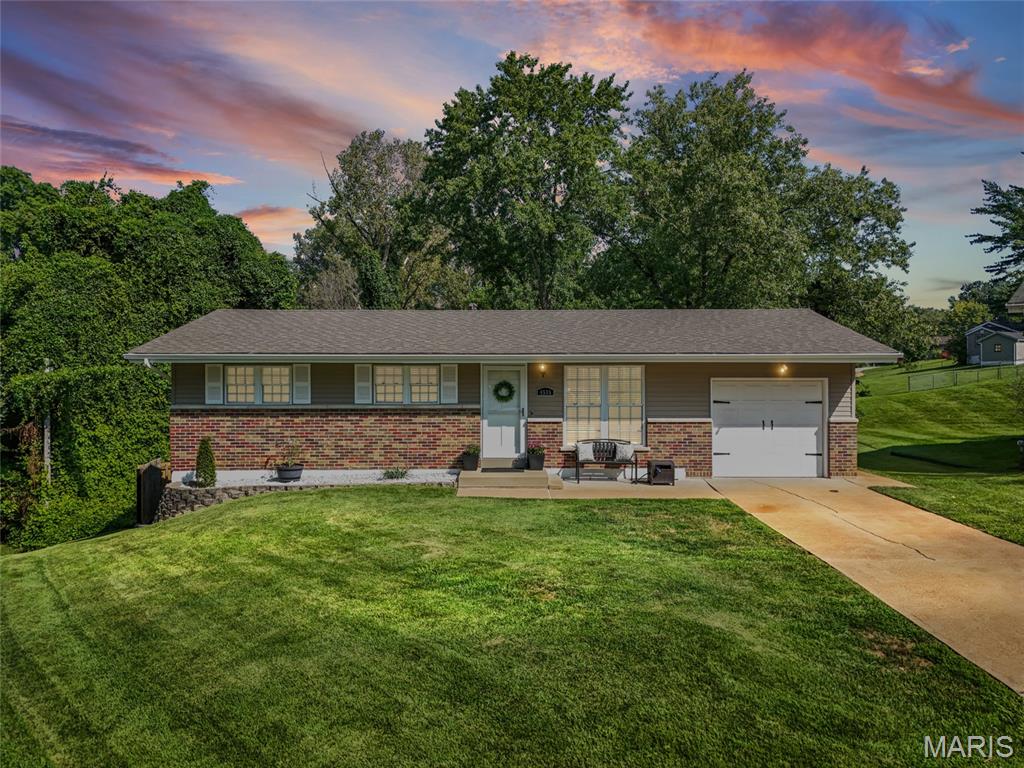 Welcome to this beautifully maintained Oakville ranch, tucked away on a quiet cul-de-sac on a 1/4-acre lot, and plenty of room to spread out. The main level has a clean, updated feel with hardwood flooring, natural light and a refreshed kitchen featuring tile flooring, updated cabinetry, pantry, stainless steel appliances, a new stove in 2026 and dishwasher in 2025. Three bedrooms and a full bath complete the main floor. 
The partially finished walkout lower level adds even more space with a bright flex room offering direct patio access, a convenient half bath and a large carpeted rec room. Use the additional room as a home office, guest space, workout room or sleeping area. The unfinished portion provides laundry, utility space and additional storage.
Outside, enjoy both a freshly painted deck and a large newer patio overlooking the mostly level and fully fenced backyard. The gazebo and storage shed both stay! Recent improvements include a roof (2023), partial siding and gutters (2025), fencing (2022), basement windows (2023), lower-level carpeting (2021) and water heater (2020). A one-car attached garage completes this home. This location puts shopping, dining, parks and everyday conveniences within minutes, and quick access to both I-270 and I-255. See it today!