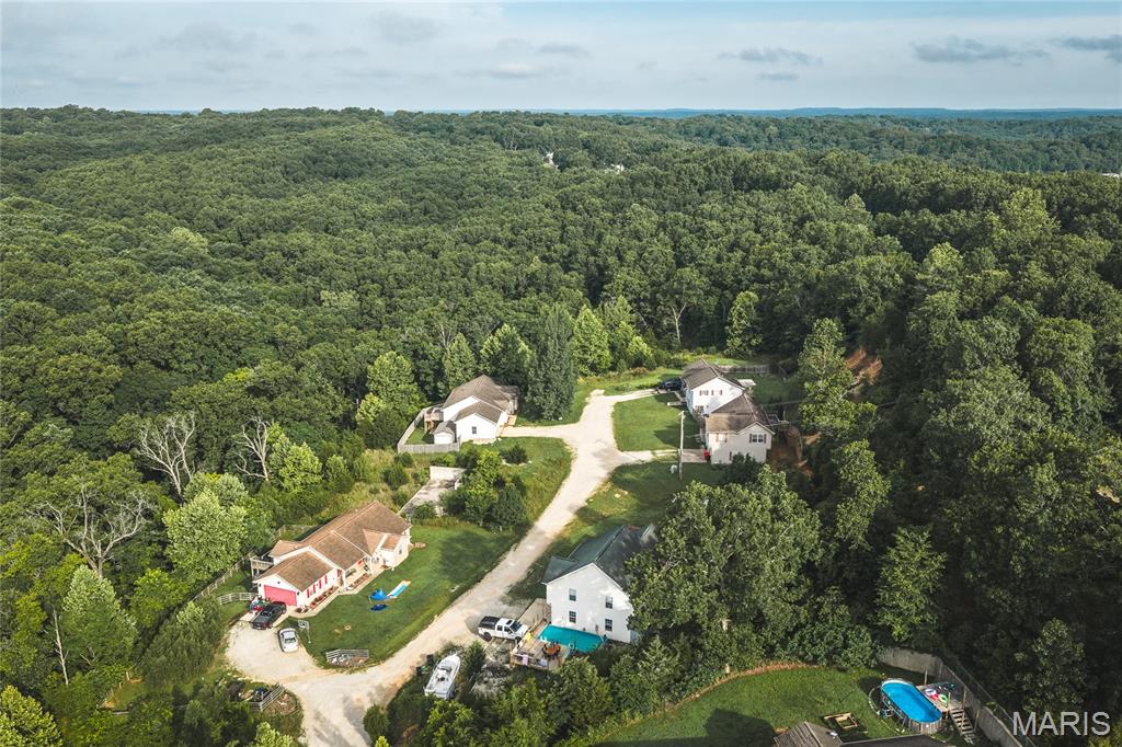 Rare opportunity to own approximately 21 acres spanning multiple lots within an established subdivision in St. Robert! Whether you're looking for development potential, investment opportunities, a private family compound, or the perfect place to build your dream home, this unique offering provides endless possibilities. Several lots have already been cleared and feature paved access, making future building plans even more convenient. Enjoy the flexibility of multiple parcels while maintaining privacy and space to create your vision. With a combination of wooded and cleared areas, this property offers the best of both worlds. Opportunities like this don't come along often—schedule your private tour today and explore the potential for yourself!