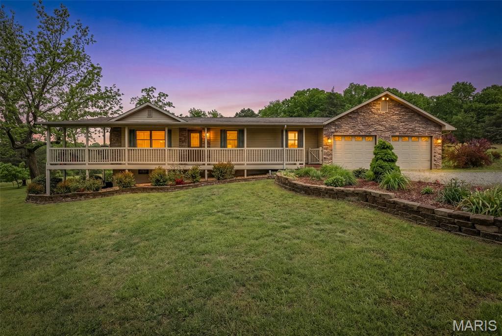 Tucked away in the rolling countryside of Fredericktown, this breathtaking 24+/- acre farm offers the kind of peaceful country lifestyle people dream about. From the moment you arrive, you’ll be captivated by the charming 3 bed, 3 bath ranch-style home complete with an attached 2-car garage, a fully finished walkout basement, and a stunning wraparound covered deck perfect for soaking in the quiet views of your own private retreat. Inside, the beautiful kitchen serves as the heart of the home with warm, inviting spaces designed for both everyday living and gathering with loved ones. Step outside and explore everything this incredible property has to offer — a picturesque pond, two barns ready for livestock, hobbies, or storage, and even a cozy hunting cabin tucked away for weekend adventures. Whether you’re searching for a working farm, recreational getaway, or simply room to breathe and enjoy the outdoors, this property delivers endless opportunity and timeless country charm.