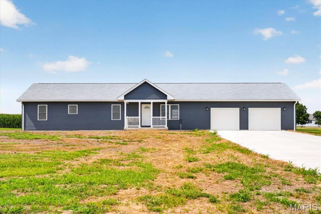 Welcome to your own slice of country living! Built in 2025, this beautifully crafted 3-bedroom, 2-bath ranch offers the perfect blend of modern comfort, quality construction, and peaceful surroundings on just over an acre. Designed with both functionality and style in mind, this home is ideal for those looking for the convenience of one-level living with room to grow. Step inside to an inviting open-concept floor plan filled with natural light, where the spacious living room flows effortlessly into the dining area and kitchen, creating the perfect space for everyday living and entertaining. The kitchen features ample cabinetry, generous counter space, and a layout that keeps everyone connected.
The private primary suite offers a relaxing retreat with a full ensuite bath and generous closet space. Two additional bedrooms and a second full bath provide flexibility for family, guests, or a home office. Main-floor laundry adds everyday convenience. The oversized 2-car garage offers plenty of room for vehicles, storage, tools, or recreational equipment, while the full unfinished basement presents endless possibilities for future expansion, whether you envision additional bedrooms, a family room, home gym, workshop, or entertainment space. Step outside and enjoy the peaceful setting from the covered rear porch, the perfect place to sip your morning coffee, unwind after a long day, or entertain family and friends while taking in the scenic views. Situated on just over an acre, there's plenty of room to garden, play, build a future outbuilding, or simply enjoy the privacy and freedom that comes with country living.

If you've been searching for the benefits of new construction without the wait, this move-in-ready home is a rare opportunity. Offering quality craftsmanship, modern finishes, an oversized garage, covered rear porch, and room to grow inside and out, this home is ready to welcome its next owners. Schedule your private showing today!