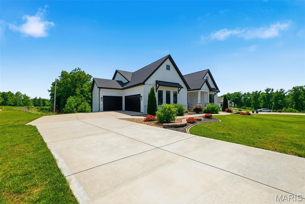 Welcome home to this newer custom built ranch home with 3 car side entry garage and a gorgeous in-ground pool in you over 1/2 acre fenced back yard. If you are looking for a custom built home with unique craftsman style finishes along with an open floor plan with stunning engineered wood flooring, this is your home. It has beautiful wood beams in several rooms, high coffered ceilings as well and perfect for entertaining with a huge quartz island and granite counters surrounding. The large formal dining room is open to the great room and kitchen/breakfast room. The great room has a wood burning fireplace flanked by windows over looking the back yard with a tree line and a large in-ground pool. The kitchen has high end GE Cafe appliances with a gas stove w/ large custom hood, microwave drawer and a coffee bar area with a wine/beverage cooler. Off the breakfast room you will enjoy a covered composite deck w/ stairs down to a patio and the pool. The home also has the divided bedroom floor plan with the primary off the great room and the other 2 bedrooms on the main level are in the front of the home. The primary is so spacious with a inviting primary bath with double vanities, step up to the large soaking tub and walk in shower as well as a huge walk in closet. The lower level is mostly finished and a walk out as well. You will enjoy a bar area with a custom built in booth, a step up theater room, a 4th bedroom and full bath, plenty of storage and a large workshop area as well. This home is located in a prime location only minutes to HWY 70 AND HWY 40, yet located off a quiet road on a single cul de sac street with a handful of newer custom homes. SHOWINGS START ON SUNDAY MAY 31
