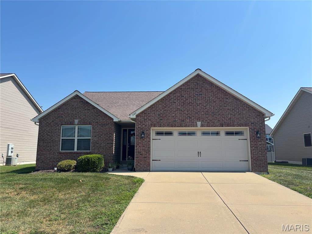 Welcome home to this beautifully-maintained 2-bedroom, 2-bath low maintenance ranch. The moment you step into the foyer you're greeted by the gleaming hardwood floors and the vaulted ceiling. The spacious living room has tons of natural light, featuring two large windows that frame a cozy gas fireplace. The kitchen offers granite counters, plenty of cabinets, a breakfast bar and stainless steel appliances. There is a separate laundry room with a large pantry off the kitchen. Just beyond the kitchen is an inviting sunroom perfect for morning coffee or an evening unwinding. The primary suite boasts a subtle tray ceiling, a walk-in closet and a full bath with a separate jacuzzi tub and shower. The second bedroom is located just steps from the second full bath. There is a full basement with an egress window, and bathroom rough in offering endless possibilities for additional living space.
