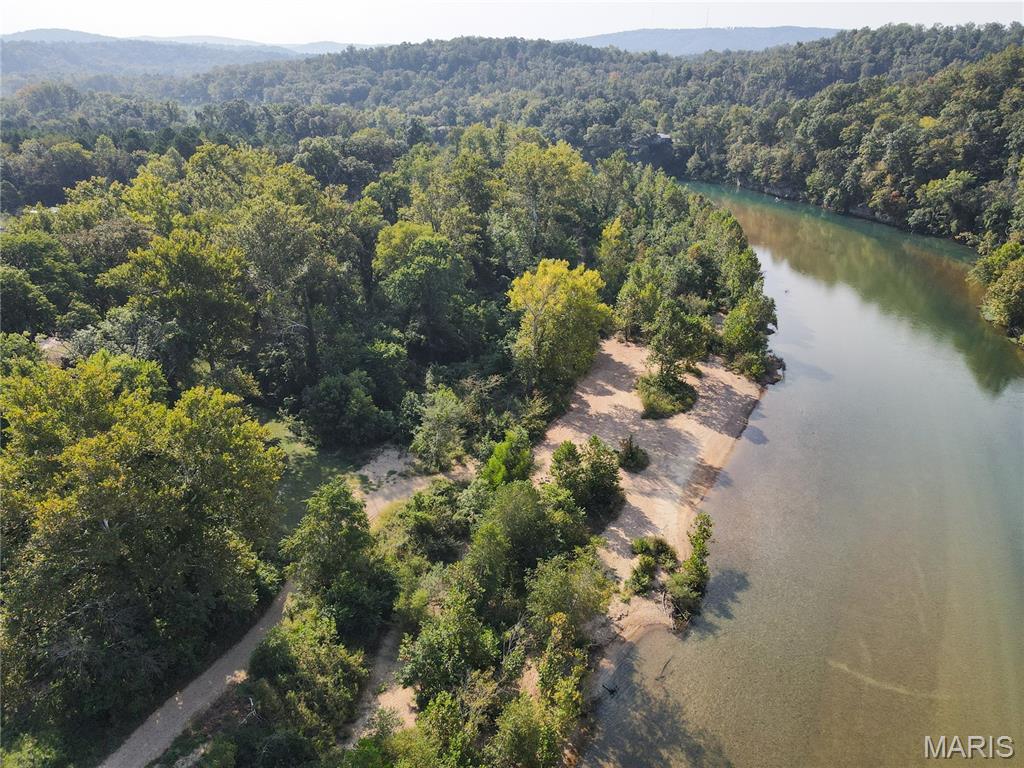 Discover your private retreat at 56 Leickle Drive in Van Buren, Missouri. This charming 3-bedroom, 2-bath cabin is a perfect low-maintenance getaway or year-round residence. Situated on the water just above the iconic Shote Hole, the property offers a peaceful and private setting with a stunning gravel bar just a few steps below, perfect for relaxing or enjoying the clear Current River. 

Designed for efficiency and comfortable living, this home requires minimal upkeep, allowing you to maximize your time outdoors. Complete renovation completed in summer of 2018. The convenient location provides both tranquility and easy access to the water, with a boat launch just a few hundred feet down the road, making it simple to get out on the river for fishing, floating, or boating.

Embrace a life of ease and natural beauty at this hidden gem.