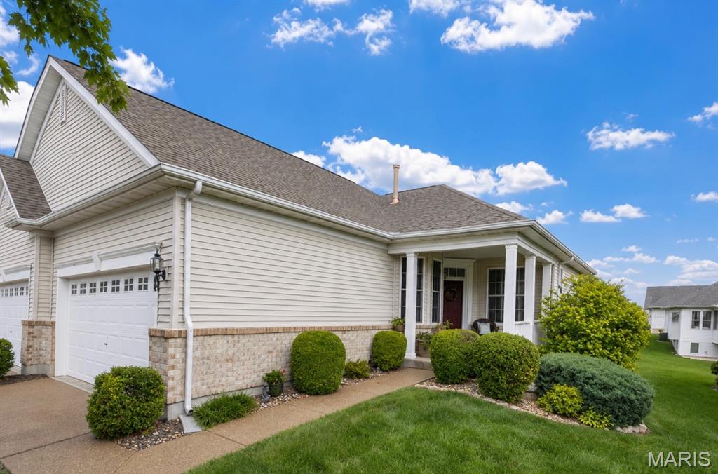 MOTIVATED SELLER!! BRING US AN OFFER!

Want the freedom of low-maintenance living without giving up space, a 2-car garage, and resort-style amenities? This one checks the boxes! Welcome to easy living in the highly desirable Heritage of Hawk Ridge 55+ community! This beautifully updated 2 bed, 2 bath attached end-unit villa offers approximately 1,264 sq ft and an unbeatable location just a short walk to the clubhouse, golf course, pro shop, tennis courts, and fitness center.

Step inside to find fresh paint throughout and numerous updates including painted 42” kitchen cabinets, updated lighting, brand new refrigerator, and newer vinyl plank flooring throughout the kitchen, main living areas, and bedroom. The spacious primary suite features newer carpet, while both bathrooms have been tastefully updated with newer cabinetry, flooring, lighting, and finishes. The primary bath showcases a stylish tiled shower, updated flooring, cabinet, lighting, and barn door.

Enjoy relaxing mornings or peaceful evenings on the large covered porch, offering the perfect space for sitting, entertaining, or simply enjoying the beautifully maintained surroundings.

Additional updates include newer HVAC (approx. 10 years), roof, water heater, sump pump, composite deck, and new windows in the primary bedroom and living room. Main floor laundry offers convenient shelving, while the spacious unfinished lower level provides excellent storage, bath rough-in, and endless possibilities for additional living space.

Outside, enjoy the landscaped yard, irrigation system, and attached drywalled 2-car garage. Monthly maintenance includes lawn care, snow removal, and use of amenities, making for truly low-maintenance living. Residents also have access to the community’s beautiful 9-hole golf course available for an additional fee.

Fantastic opportunity to enjoy the active Hawk Ridge 55+ community lifestyle with resort-style amenities and a beautifully updated home ready for its next owner! If you're ready for more time enjoying your home and less time maintaining it, come see why this one stands out.