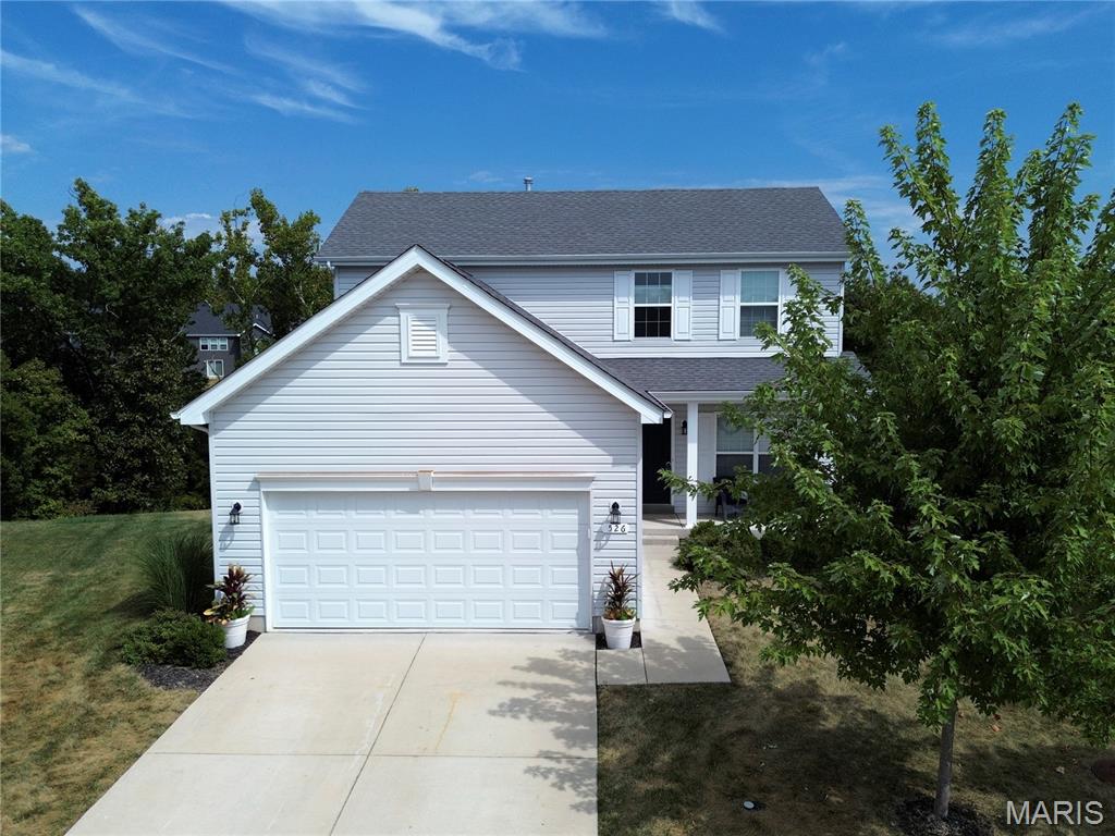 Exceptional comfort and convenience await in this pristine, 6-year-young two-story home in Lake St. Louis's highly desirable Wyndstone community! This move-in-ready gem features 3 bedrooms, 2.5 baths, and a bright, functional layout designed for modern living. The gourmet kitchen boasts upgraded cabinetry, a handcrafted gas range hood, a custom coffee station, quartz countertops, a tile backsplash, and seamless flow into the main living areas. Upstairs, enjoy spacious bedrooms, a private primary suite with built-in closet organization, and convenient second-floor laundry. Step outside to your peaceful private backyard retreat featuring a paver patio, Jacuzzi, and fire pit with tempered fire glass—perfect for entertaining or relaxing. Prime location with quick access to I-64, Hwy N, Hawk Ridge Trail, The Meadows, and top-rated parks!