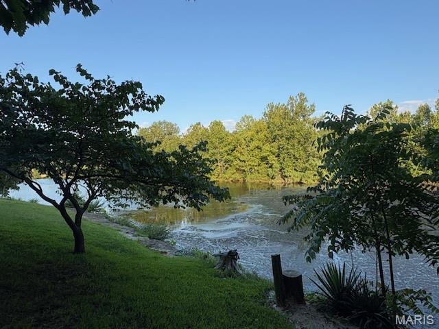 Lake Front Lot on just over 1/2 Acre Lot on Small Private Lake / Summer Lake! This a private oasis on this approxe 12 acre lake. Imagine walking out your back door and casting out your line ... 

Live like you're on vacation every day with resort-style amenities, also including:

4 private community lakes for fishing, boating, kayaking

Beaches, swimming, and scenic lake views

Golf course, country club, and on-site restaurant

Hiking, biking trails, campgrounds, and sand volleyball

A golf cart-friendly community for relaxed neighborhood living

You can bring your own builder and plans, or hold the land as an affordable way to enjoy Raintree's full range of recreation and lifestyle benefits.

Ownership includes access to the Country Club for just $271/year, and full community amenities for only $250/year. All of this just 35 minutes from South County (63128)!

Build your own lifestyle and just getaway from it all.  See all photos for a glimpse into the incredible Raintree lifestyle. As a resident myself, I can confidently say: it’s an amazing place to live, play, and relax. Come join us!