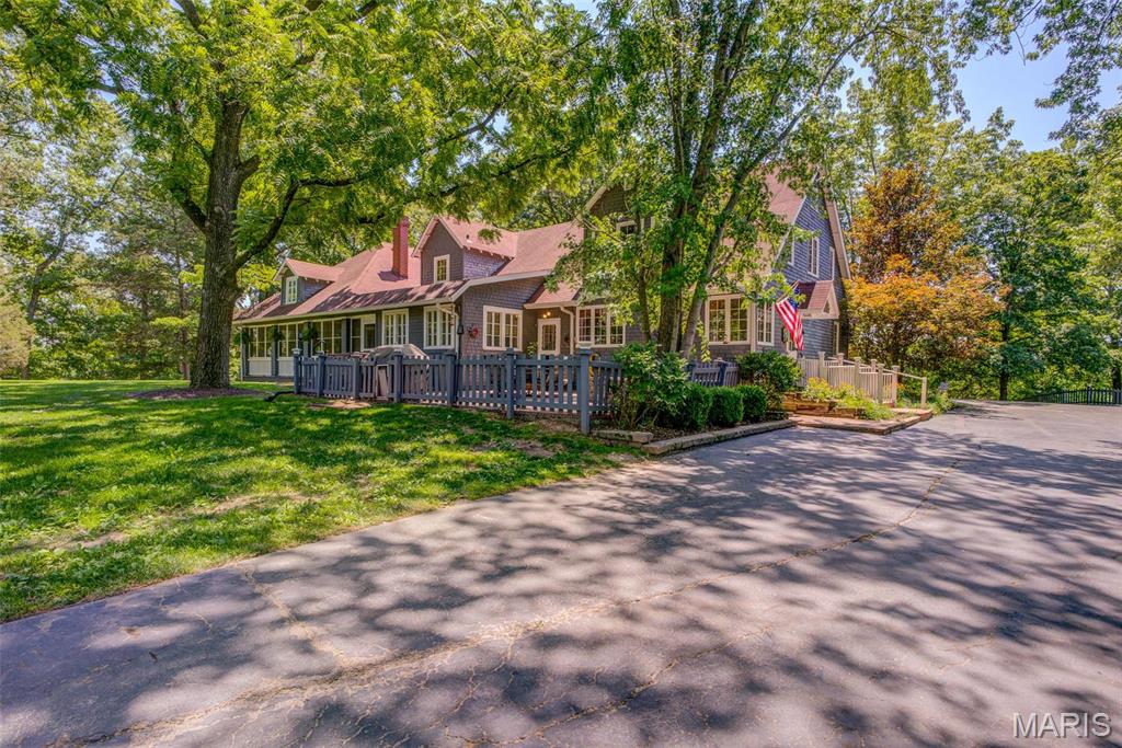An EXQUISITE EQUESTRIAN ESTATE nestled in the woods amongst 14+/- scenic rolling acres in Chesterfield along Kehrs Mill Road! Idyllic & rare, this extraordinary estate features a sprawling, custom designed 4,125 sq ft, 7 bedroom, 3 full & 1 half bath, pool, pool house, barn, 1 paddock, 1 pasture, and workshop! 2 story home w/impressive architectural detail, original wood flooring & abundant windows allowing expansive views of the lavish acreage! Perfect location for your dream home, a contemporary farmhouse, or even a country estate. Within the Rockwood School District with easy access to Hwy 40/64, shopping, dining, and Chesterfield Valley amenities. ALL buildings are being sold "as is", NO Seller's Disclosure available. DUPLICATE LISTING OF MLS#25026775.