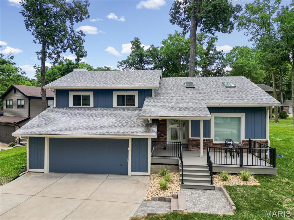 Welcome to luxury lake living in the heart of Lake St. Louis! Nestled on a quiet cul-de-sac corner lot, this beautifully maintained 4-bedroom, 3-bathroom home offers stunning lake views and lake access just steps away.

Inside, you'll find gorgeous hardwood flooring throughout and a thoughtfully designed floor plan perfect for everyday living and entertaining. The custom kitchen features beautiful custom cabinetry, granite countertops, a built-in Sub-Zero refrigerator, stainless steel appliances, and ample workspace for the home chef. Just off the kitchen, step onto the spectacular new 43' x 12' deck (2026), where you can relax and enjoy breathtaking views of the lake.

The finished lower level expands your living space with a cozy wood-burning fireplace, a spacious 4th bedroom, full bathroom, laundry room, and additional flex space ideal for a home gym, recreation room, or media area.

This home has been meticulously maintained with numerous recent updates, including a new water heater and water softener (2025), freshly painted exterior (2026), new front and rear decks (2026), and a new garage door (2026).

As a resident of Lake St. Louis, you'll enjoy access to an unmatched array of amenities, including lakeside dining, live music, ballroom events, golf, tennis, pickleball, beaches, pools, fitness center, ski clubs, fishing, kayaking, social clubs, and year-round community activities.

Whether you're entertaining on the deck, enjoying a day on the water, or taking advantage of the Lake St. Louis lifestyle, this exceptional property offers the perfect blend of luxury, comfort, and recreation. Opportunities like this are rare, don't miss your chance to make this beautiful lake-view home your own! Seller is providing 1 year Choice Ultimate Home Warranty!