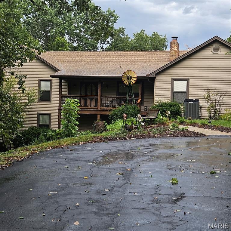 Beautiful meticulously maintained home with private setting between Washington and Union. Washington Schools. 4 car oversize attached garage, Plus additional  40'x30' utility building with 10' doors and 30'X10' Lean too. Multi level composite deck off dining area and lower level walkout basement. Hardwood doors on mail level, huge kitcken with lots and lots of cabinets, full stone fireplace in the living room, oversized master bath, designer lighting on main level. approximately 80% of the lower is finished for family and friends entertaining. LIGHTED SAUNA IS INCLUDED! Sit on trhe front porch and overlook the parklike maintained wooded area. (Deer but no Antelope play)