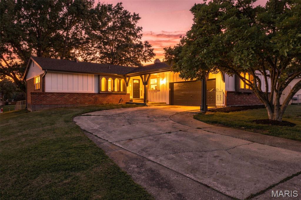 Beautifully renovated and move-in ready, this exceptional 3-bedroom, 2.5-bath ranch offers approximately 2,400 square feet of finished living space and an ideal blend of style, comfort, and functionality. The main level showcases high-end laminate flooring throughout, a stunning updated kitchen featuring crisp white cabinetry, quartz countertops, stainless steel appliances, and a gas range. New windows, architectural shingle roof, trim, and interior 2 panel doors add a fresh, modern touch throughout the home.  The spacious primary suite includes a large walk-in closet and beautifully updated private bath. Two additional generously sized bedrooms and an updated hall bath provide ample space for family and guests. Designed for both everyday living and entertaining, the main floor also features an inviting great room, a separate living room with a cozy woodburning fireplace, and a formal dining room.  The finished lower level expands the living space with a large recreation room, a versatile bonus room ideal for guests, a home office, or hobby space, and a convenient half bath. Situated on a fenced quarter-acre corner lot, this home offers plenty of outdoor space for play, pets, and entertaining. A truly turnkey opportunity with quality updates throughout.