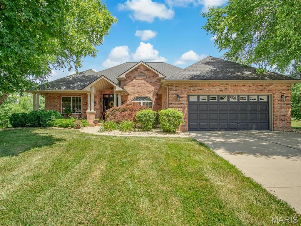 Welcome to 1534 Chesterfield Court in Swansea, where exceptional indoor living meets your own private backyard retreat on a beautifully landscaped 1.16-acre lot. Nestled on a quiet cul-de-sac, this stunning walkout ranch offers the perfect blend of luxury, comfort, and functionality.

From the moment you arrive, you’ll appreciate the mature trees, manicured landscaping, and inviting curb appeal. Inside, soaring vaulted ceilings, abundant natural light, and beautifully refinished hardwood floors (2024) create a warm and welcoming atmosphere. Fresh interior paint completed just one year ago gives the home a bright, move-in-ready feel.

At the heart of the home is a beautifully updated kitchen designed to impress both everyday cooks and avid entertainers. Featuring an abundance of custom cabinetry, elegant hard surface countertops, a stylish tile backsplash, glass-front display cabinets, under-cabinet lighting, a spacious center island with seating, double wall ovens, and an electric cooktop, this space blends timeless style with exceptional functionality. Whether you’re preparing weeknight dinners or hosting holiday gatherings, you’ll appreciate the generous workspace, abundant storage, and seamless flow into the breakfast area and vaulted great room with a cozy fireplace.

The spacious main-level primary suite offers a relaxing retreat with a large walk-in closet and private ensuite bath featuring a dual vanity, jetted soaking tub, and separate shower. Two additional bedrooms, formal dining room, main-floor laundry, and an enclosed sunroom overlooking the backyard complete the thoughtfully designed main level.

The finished walkout lower level expands your living space with a spacious recreation room, billiard area, walk-behind dry bar, additional bonus room, full bath, and ample storage—perfect for entertaining, overnight guests, or multi-generational living. A lower-level garage and workshop provide exceptional flexibility for hobbies, lawn equipment, or additional storage.

Step outside and discover the backyard you’ve been dreaming of. Designed for both entertaining and relaxation, this private outdoor oasis features an in-ground saltwater pool with a new liner installed in 2020, expansive concrete decking, vinyl fencing, and a spacious poolside pavilion that’s perfect for hosting summer gatherings or enjoying quiet evenings in the shade. The beautifully landscaped 1.16-acre lot provides plenty of room to spread out while maintaining a peaceful, private setting.

One of the property’s most unique features is the separate rear entrance, offering additional gravel parking and direct access to the lower-level garage—ideal for storing recreational vehicles, trailers, boats, lawn equipment, or creating the ultimate workshop.

Offering an exceptional combination of quality updates and versatile living spaces, 1534 Chesterfield Court is a place you’ll love coming home to.