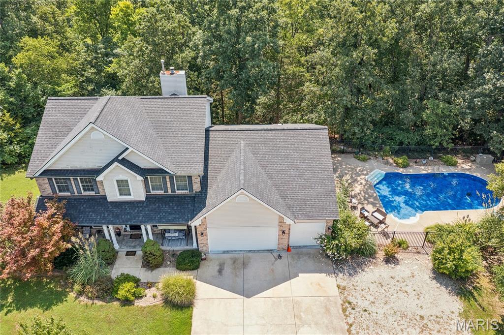 Your Private Retreat on about 10 Acres! Experience the perfect combination of spacious living, privacy, and outdoor enjoyment in this impressive two-story home offering over 4,300 square feet of finished living space on approximately 10 beautiful, wooded acres. With 4 bedrooms, 3.5 bathrooms, a finished walk-out basement, three-car garage, and an inground pool, this property offers the space and setting you’ve been searching for.

Step inside to a welcoming open floor plan designed for both comfortable everyday living and entertaining. The spacious primary suite provides a private retreat with a large bedroom and walk-in closet, while three additional bedrooms offer plenty of room for family, guests, or a home office and also have walk-in closets.

The finished walk-out basement expands your living and entertaining possibilities and provides convenient access to the outdoors. Outside is where this property truly shines. Relax or entertain on the large deck, spend summer days around the inground pool, or simply enjoy the peace and privacy of your own wooded acreage.

With approximately 10 acres, you’ll have room to spread out and enjoy the tranquility of rural living while still having all the comforts of a spacious, well-appointed home. The three-car garage provides plenty of room for vehicles, storage, hobbies, and outdoor equipment.
If you’ve been searching for acreage, privacy, abundant living space, and your own backyard pool, this property delivers it all. Come experience the space, serenity, and lifestyle this exceptional property has to offer!