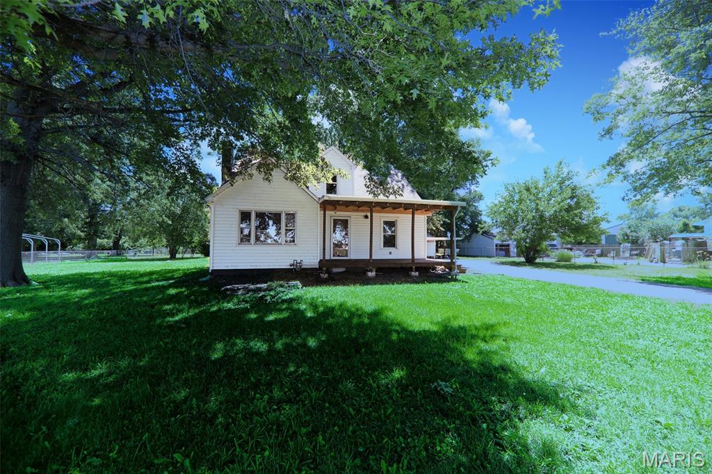 REHABBERS SPECIAL!  Much of the heavy lifting has already been completed - bring your finishing touches and make this spacious home your own.   Featuring 4 bedrooms and 3 baths, this property offers plenty of room to create the home you envisioned.  Situated on a 1 acre lot, there's ample outdoor space for recreation, gardening or future improvements.  A detached 2 car garage provides additional storage and parking with a covered patio attached.  Great opportunity for investors, flippers or buyers looking to build equity.  Roof - 2025, HVAC - 2025 and water heater 2014.  Electric has been updated. Flooring throughout has been done along with many fixtures and improvements.  Needs finishing touches.  Buyers to verify all information provided as it is gathered from various sources.  This will not go fha, va or traditional conventional. SOLD AS IS!!