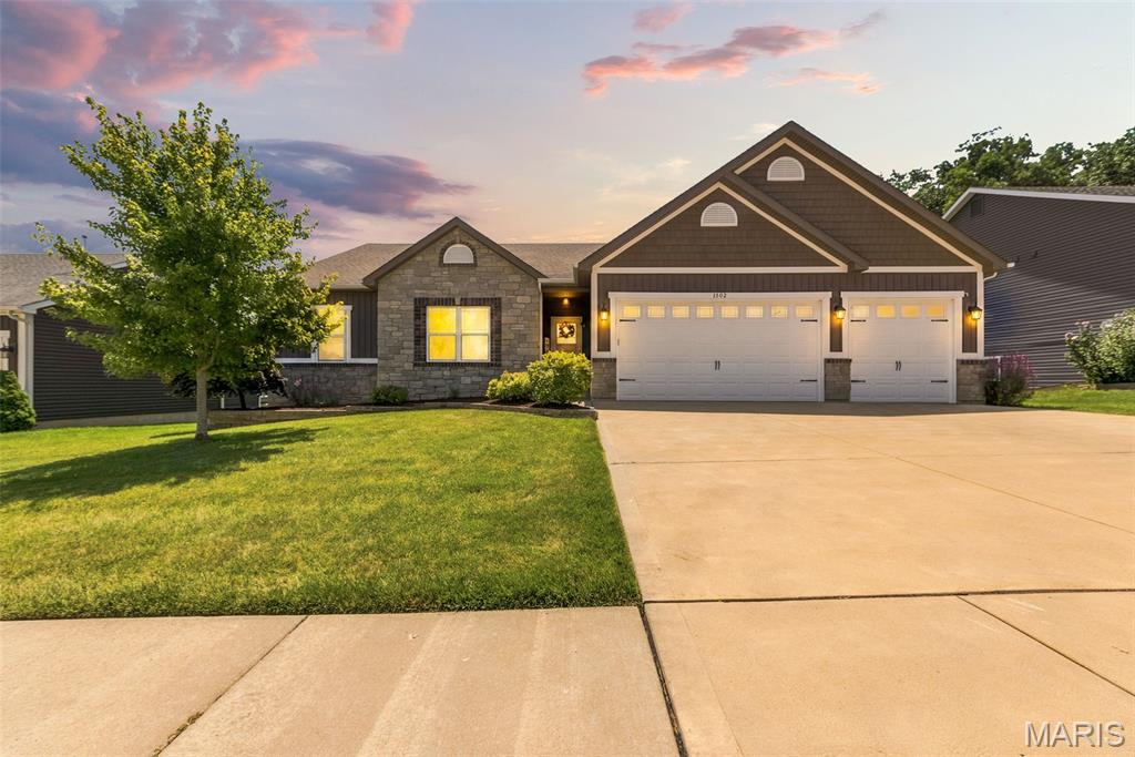Stunning Walk-Out Ranch with Over 3,600 Sq. Ft. of Finished Living Space!
Welcome home to this beautifully designed split-bedroom ranch tucked away at the end of a beautiful cul de sac, offering privacy, space, and exceptional upgrades throughout. With over 3,600 square feet of finished living space, this home is perfect for both everyday living and entertaining.
Step inside to find 10-foot ceilings, rich hardwood floors throughout the main living areas, elegant crown molding, and a bright great room featuring transom windows that fill the home with natural light. The chef's kitchen boasts 42-inch white cabinetry, granite countertops, a large center island, breakfast bar, walk-in pantry, gas range, and spacious breakfast/dining area.
The luxurious primary suite is a true retreat, complete with a sitting area and spa-inspired bath featuring a tiled walk-in shower with glass doors, dual vanities, tile flooring, and a private water closet.
The finished walk-out lower level expands your living space with a large family room, private bedroom and full bath, dedicated office/craft room with glass French doors, abundant natural light, and two oversized storage rooms. Step outside to the covered patio, protected by a Rain Guard system, or enjoy the elevated deck with stairs leading to the fully fenced backyard.
Additional highlights include:
Oversized 3-car garage with 8-foot doors
Irrigation system
Spacious mudroom and separate laundry room
3.5 bathrooms
Split-bedroom floor plan
Fully fenced backyard
Desirable school district
Convenient access to major highways
This home offers the perfect combination of luxury, functionality, and location, don't miss your opportunity to make it yours!