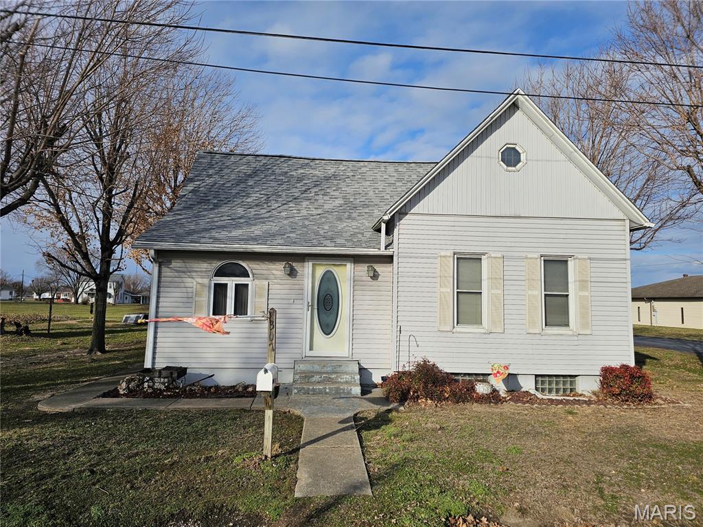 Discover comfort and convenience in this cozy home situated on a generous corner lot.  Boasting a large two-car pole barn garage, this property offers ample space for parking and storage.  Inside, you'll find a welcoming living room with a dining area, and a well-appointed kitchen.  The home features two comfortable bedrooms, one bathroom, and a finished loft area that can serve as a versatile space.  Plus, there's a bonus room perfect for a family room or additional living space.  In addition, the full basement adds plenty of extra space and includes a large laundry area, making this home both functional and spacious.