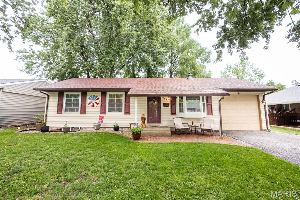 Welcome Home! This well-maintained 3-bedroom, 2-bath home offers an open and inviting floor plan with plenty of space to live and entertain. The spacious living and dining areas flow into the eat-in kitchen featuring stainless steel appliances and plenty of cabinet storage. Step outside from the kitchen to the covered deck overlooking a fenced backyard with no neighbors directly behind the property. The finished lower level expands your living space with a large family room, full bathroom, laundry area, bonus room and an additional sleeping area with closet. Enjoy peace of mind with updates including a NEW roof (2025), newer A/C (3 years old), and some newer appliances. Additional features include fresh paint, a 1-car attached garage and sump pump. Conveniently located close to parks, schools, interstate access and Scott AFB. This home is ready for a new owner, don't miss it!