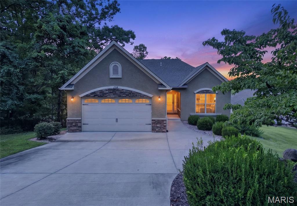 Lake living at its finest! Situated on .59 acres, this charming 3 BR/3 BA home is located off the #3 tee box at Old Kinderhook. Just minutes from Camdenton, amenities abound including the championship Tom Weiskopf-designed golf course, marina, spa, restaurants, golf pro shop, pools, fitness center, tennis, pickleball, outdoor ice skating rink and lodge at your disposal. Featuring hardwood floors, vaulted ceilings, open concept living and a finished walk-out basement, this home offers plenty of space for all your needs. The kitchen features a breakfast bar, granite countertops and stainless-steel appliances including electric range, refrigerator, dishwasher, disposal and built-in microwave. The primary bedroom includes a four-piece ensuite and large walk-in closet. Downstairs is a spacious family room, extra bedroom with patio access through a slider door, full bath and storage area that can used for whatever you need. While the home is perfect for a full-time residence, much of the home furnishings are negotiable with the purchase and in like-new condition making this a great weekend get-away or an income producing property! All this located within a 700-acre gated community with 24-hour security. Don't miss out on this one!