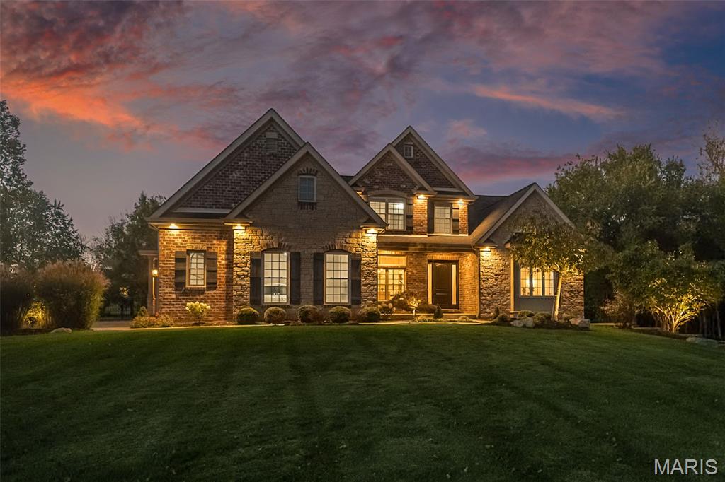 The Birchwood at Bates Bend - This site is in the prime location of Dardenne Prairie and is the Builder's personal residence. The Estate Lot is 1.8 Acres with an irrigated and pampered lawn where the residence is positioned 250 feet from the road for a grand approach and free of HOA rules. Destined for parties for a crowd or just impromptu fun. The front meadow is ready for wedding tents, family soccer tournaments and a future pickle ball court could easily be in your dreams for the rear extensive lawn area.  The long driveway becomes the Red Carpet for any event. All that is missing is the paparazzi!   *****The Inspiration of the Birchwood Residence was a collective effort of Architect Larry Spraul of LR Spraul Designs, and Custom Builder Tim Griffey of Griffey Custom Homes. The overall theme was to incorporate three loves: “The love of the outdoors”, “Comfortable, yet dramatic spaces”, and “The celebration of fine craftsmanship” that is displayed throughout the home. The inspiration and careful direction of the concept resulted in a special home to share with family and friends, from small gatherings to large memorable events. So many memories are awaiting…..  The positioning of the structure led to the creation of several exterior zones:  The large meadow has been home to pampering all guests including the 2 resident labs who have worn out the owners with their mastery of “Fetch”. You could also evolve into a skilled “referee” for family football and be rewarded with a whistle to control the crowd. The aluminum fenced rear yard has proven to keep the 4-legged residents and a herd of wild grandchildren corralled and is large enough to have court sports and a pool.  .......The yard flows to the right of the home to a private patio area from the walk-out lower level with an additional 2,361 square feet of high ceiling spaces to ignite your imagination.  When the pups and kids are coated with the remnants of their outdoor fun, the Family Entry has a pet and people shower center for their re-entry into the pampered world of the interior. The Family Entry contains the perfect drop zones, the Expansive Laundry Center and quick Powder Room access. The finishes are exceptionally executed in every area of the home. From the Main Entry you have a sense of what lies within.  The Main Level features 10-foot Ceilings, 8 Foot Doors, and job finished hardwood floors throughout the public spaces and owner’s private spaces.  The craftsmanship begins with sleek box beamed ceiling treatment, architecturally correct window surrounds featuring transoms with cross head crowns and 8-inch base trim. The design is sleek and sculptural, with details that will easily embrace a traditional to a polished contemporary setting.  This is not a vanilla box by any means. Every corner, every view, leaves something to be discovered. The East Wing of the Main Floor is dedicated to pampering the Owners at every turn.  There is no fighting over closet space with two primary custom closets and a place for every shopping treasure. The Bedroom contains a large salon setting with fireplace and pocket doors that lead to a flex space with a breath-taking soaring hardwood ceiling. The owners used the space for a home office, but it could easily be a private den or library.   The Owner’s Suite features every item the resident royalty would demand. The shower has room for a crowd, and the acoustics could be perfect for your morning American Idol rehearsal. The large lounging tub overlooks your wooded backdrop. You may be tempted to bring a towel.  Review the extensive photography for a complete understanding of what this property offers: An Open Concept that captures the views and flows from Great Room, Private Dining Room, Family Dining, an Island that seats 8 comfortably, a fireside Hearth Room, a Kitchen that has everything including a walk-in butler pantry. Every space gives you the feeling of walking through a magazine. Owner is a licensed agent. Enjoy!!!