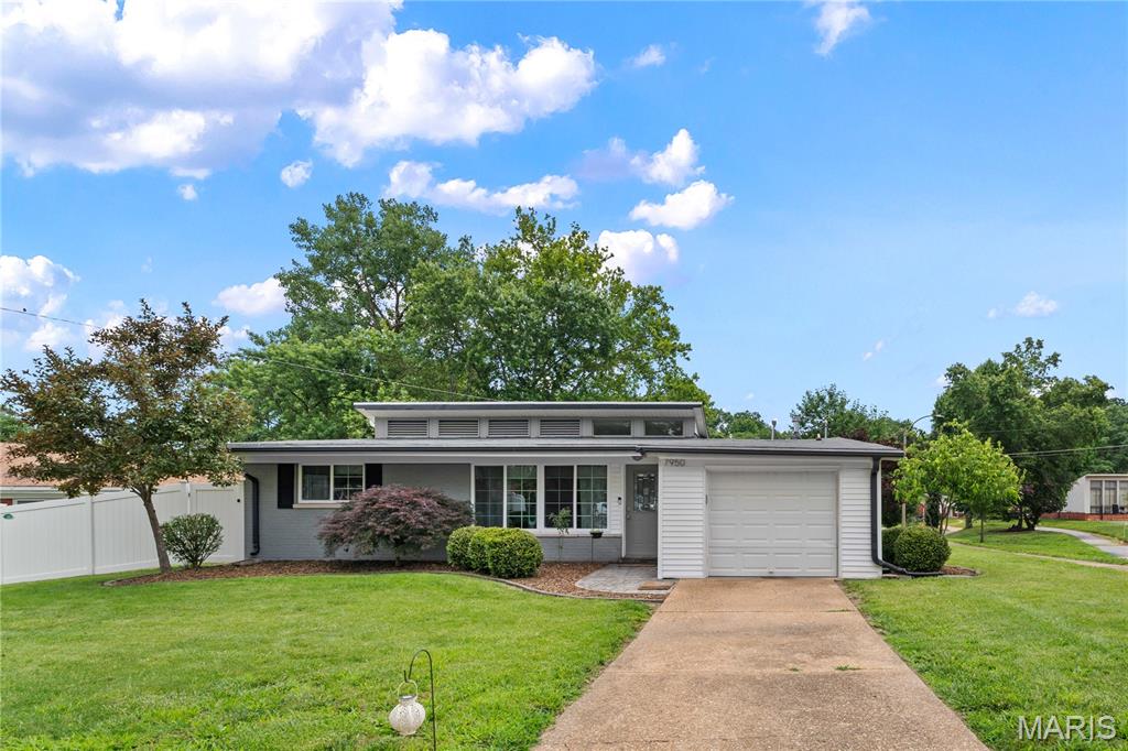 Rarely found in University City, this 4-bedroom, 2-bath brick ranch offers stylish, easy living in a convenient central location. Set on a corner lot, the home features an open and airy floor plan. The vaulted-ceiling great room flows seamlessly into the dining area, where a door opens to a private, fully fenced backyard and patio with a fire pit, café lights and shed. The updated kitchen features granite countertops, stainless steel appliances, a tile backsplash, double café dishwasher, a pantry, USB charging station and ample cabinet space. Electric fireplace in the living room adds warmth and style. The primary suite includes an en-suite bath with a tiled shower and walk-in closet. Three additional bedrooms provide flexibility for guests, a home office, or growing households. Attached garage. Just moments from shopping, dining, major highways, hospitals, and schools, this is a wonderful opportunity in a sought-after neighborhood. Kaufman Park is 1.5 blocks away with pickleball, tennis courts and a playground. Ruth Park golf course is 3 blocks away. Vivient security system and ring door camera. Keypad security door locks. Plank flooring throughout the home. Ceiling fans.