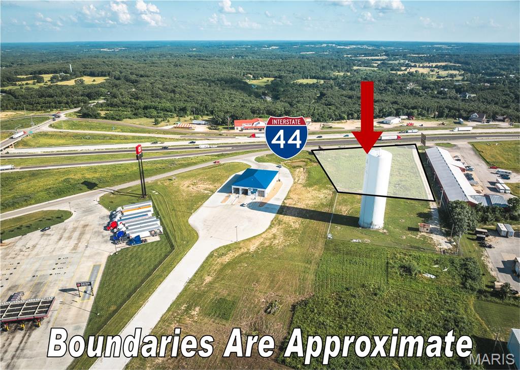 This 2.14 m/l acre commercial lot is located just off I-44 at Exit 189 in Rolla, Missouri, with direct access from Enterprise Drive and positioned immediately next to the newly developed QuikTrip Travel Center. Situated adjacent to the Hy Point Industrial Park area, the property benefits from proximity to a well-established commercial and industrial hub. Zoned C-2, it allows for a variety of commercial uses including retail, restaurant, office, drive-thru, and auto-related services. The lot is cleared, level, and ready for development, with utilities available. While a few miles from Rolla’s main business loop, this site serves as a busy stop for interstate travelers. Neighboring businesses like Love’s, McDonald’s, Subway, and QuikTrip draw steady traffic from I-44, offering excellent visibility and convenient access for highway-oriented development.