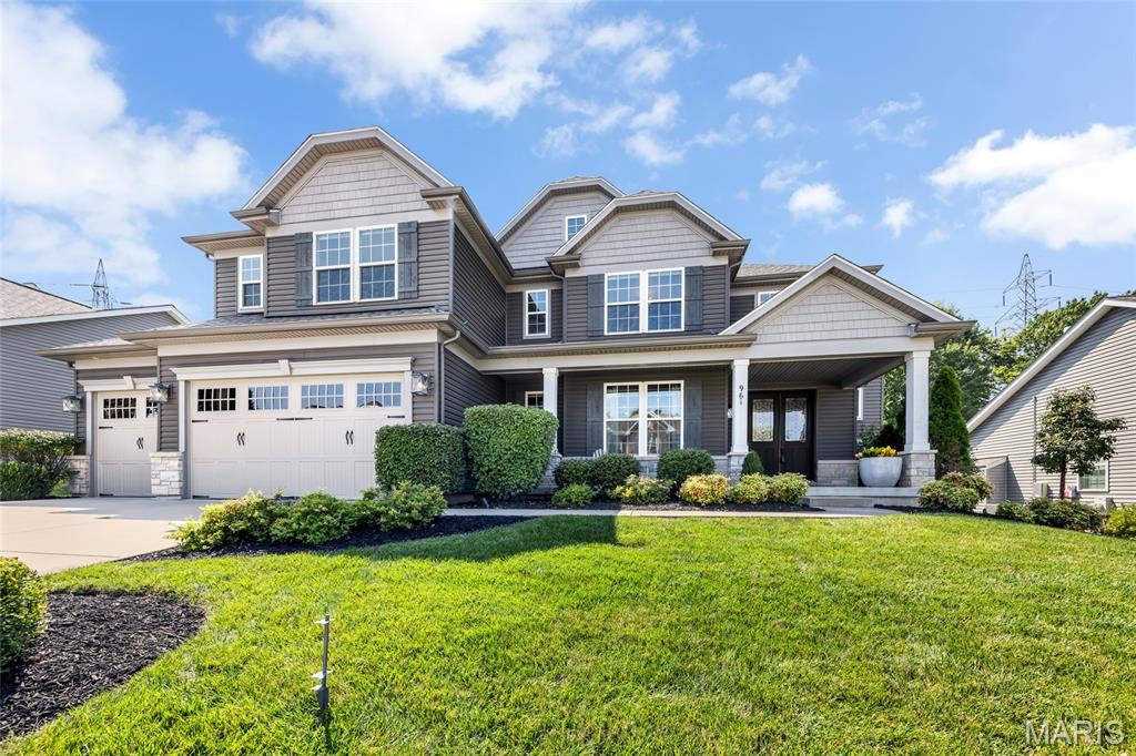 Welcome to 961 Chapelwood Court. This beautifully appointed 1.5 story former Rowles display offers over 3,800 sq ft of thoughtfully designed living space. Stunning curb appeal welcomes you into the two story foyer, opening to a formal dining room with crown molding and modern chandelier. The impressive living room showcases a beamed vaulted ceiling, custom built-ins, stacked stone gas fireplace and expansive wall of windows overlooking the backyard. At the center of the home, the designer kitchen features custom 42" cabinetry, stone counters, an oversized center island, gas cooktop with statement hood, double wall ovens, SS appliances, pantry with custom organizers and an adjoining breakfast room. The vaulted hearth room has a second gas fireplace and atrium doors leading to the patio. Tucked behind the kitchen, a dedicated office with built-in desk provides an ideal remote work space, while the mudroom with built-ins and separate main floor laundry add convenience. The primary suite is a private retreat with a sitting lounge, tray ceiling and generous walk-in closet with designer organizers. The spa-inspired ensuite bath offers dual vanities with stone counters, soaking tub and oversized tiled shower. Upstairs, a bright, vaulted bonus loft with skylights provides additional living, accompanied by three spacious bedrooms, an ensuite bath and Jack and Jill bath. The unfinished lower level includes abundant storage and the option for future finish. Outside, enjoy a fully fenced backyard and large paver patio. Additional highlights include a 3 car garage and upgraded elevation tucked on a .246 acre lot on a culdesac street - prime location, minutes from downtown Kirkwood and easy access to highways. This residence offers an impressive blend of elegance, comfort, and functionality.