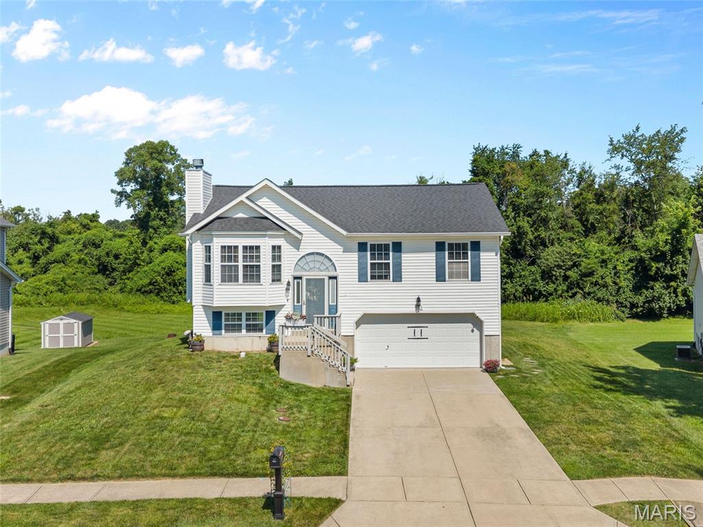 Welcome home to this beautifully maintained split-level residence offering 3 bedrooms, 3 bathrooms, and a spacious layout designed for comfortable living. Situated on a large lot in a neighborhood with abundant green space and great walking areas, this move-in-ready home combines functionality with modern updates.
The heart of the home is the expansive living room, featuring a cozy gas fireplace that flows seamlessly into the dining area—perfect for everyday living and entertaining. The open kitchen is equipped with stainless steel appliances, attractive countertops, and ample cabinetry, providing plenty of workspace for cooking and gathering.
Step outside to the oversized walkout deck, recently rebuilt with low-maintenance composite decking, creating the perfect space for relaxing, grilling, or enjoying the backyard. The deck is covered with a sturdy built gazebo for protection and peace. 
The spacious primary suite offers a private retreat with its own en-suite bathroom. Suite has bay windows for private view of back yard and plenty of light and large closets. Two additional generously sized bedrooms provide plenty of room for family, guests, or a home office.
The finished lower level features a large family room with walkout access to the backyard, along with a conveniently located full bath and laundry area.

Outside, you'll find a well-built storage shed set on a concrete pad, complete with a loft for additional storage or workspace.
With excellent curb appeal, thoughtful updates, and pride of ownership throughout, this home is in outstanding condition, offering low-maintenance living and true move-in-ready convenience. Don't miss the opportunity to make this exceptional property your next home!