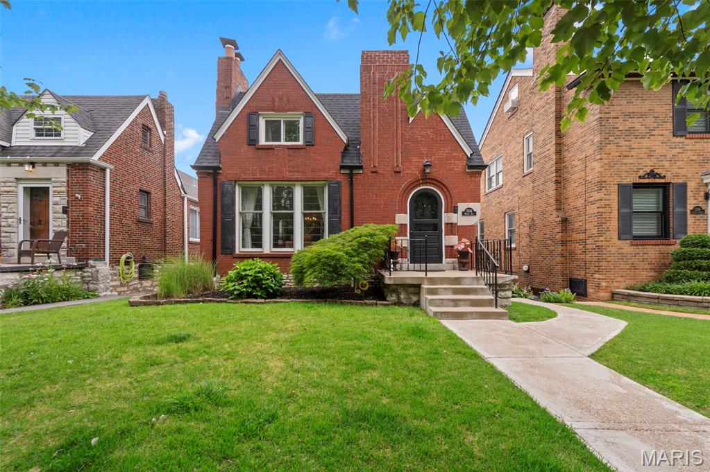 Charming brick 3BR/2BA in this sought-after South City neighborhood, brimming with original character. Sunlit living room features stained glass, arched entry, curved walls and a decorative fireplace that opens to a formal dining room. Main level also offers a primary bedroom, full bath, a cozy office and the kitchen which opens to an enclosed porch overlooking a private, entertainer-ready private backyard and detached single-car garage. Upstairs find two generous bedrooms with ample storage and an additional full bath. The lower level provides a versatile rec/sleeping area with a second decorative fireplace and abundant storage. Convenient to shopping, dining and parks—excellent blend of vintage charm and everyday function, this adorable home won't last long!