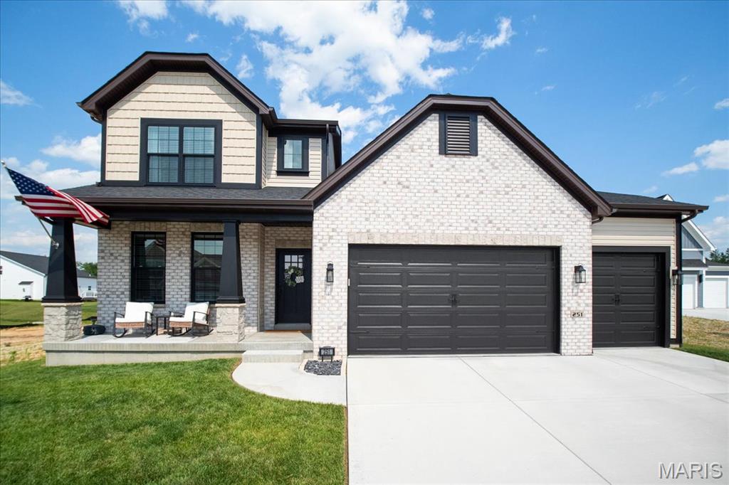 Beautiful 4 bedroom 1.5 story Madison w/ rare custom 4-car garage less than 2 years young! This home is a blend of luxury, relaxation & functionality. Step inside & you're greeted by the formal dining, currently set up as a game room accented with trendy paint & decor. Main floor Owner's Suite with luxury bath, adult height vanities, separate garden tub, walk-in shower & large walk-in closet. Natural light cascades through the open main living area w/ 11' ceilings in family room & breakfast room. Take in the ambience & relax in the family room w/ gas fireplace, recessed lighting, huge fan, expansive windows & built in Klipsch ceiling speakers. Gourmet Kitchen w/ 42" soft close cabinets, quartz center island & countertops, & walk-in pantry.  All GE Appliances; 5-burner gas stove w/ SS hood, wall oven w/ convection microwave, & dishwasher. Breakfast area w/ transom window w/ O/S 8' slider patio door leading to exquisite stamped concrete patio w/ natural gas fire pit overlooking a level backyard perfect for summertime fun or future pool! MFL doubles as a mudroom equipped w/ utility sink. Upstairs has 3 add'l bedrooms & loft/bonus room w/ some walk-in closets & full bath. Zoned HVAC damper system w/ ceiling fans in all bedrooms. Basement w/ 9' pour, rough-in bath, egress window & awaits your finishing touches. Garage has 8' doors & is 34.5' deep tandem on one side. Walking distance to Frontier Middle School & Discovery Elementary w/ Liberty High 1.2 miles away. Close to shopping @ Pointes of Hawk Ridge. Hurry in!"