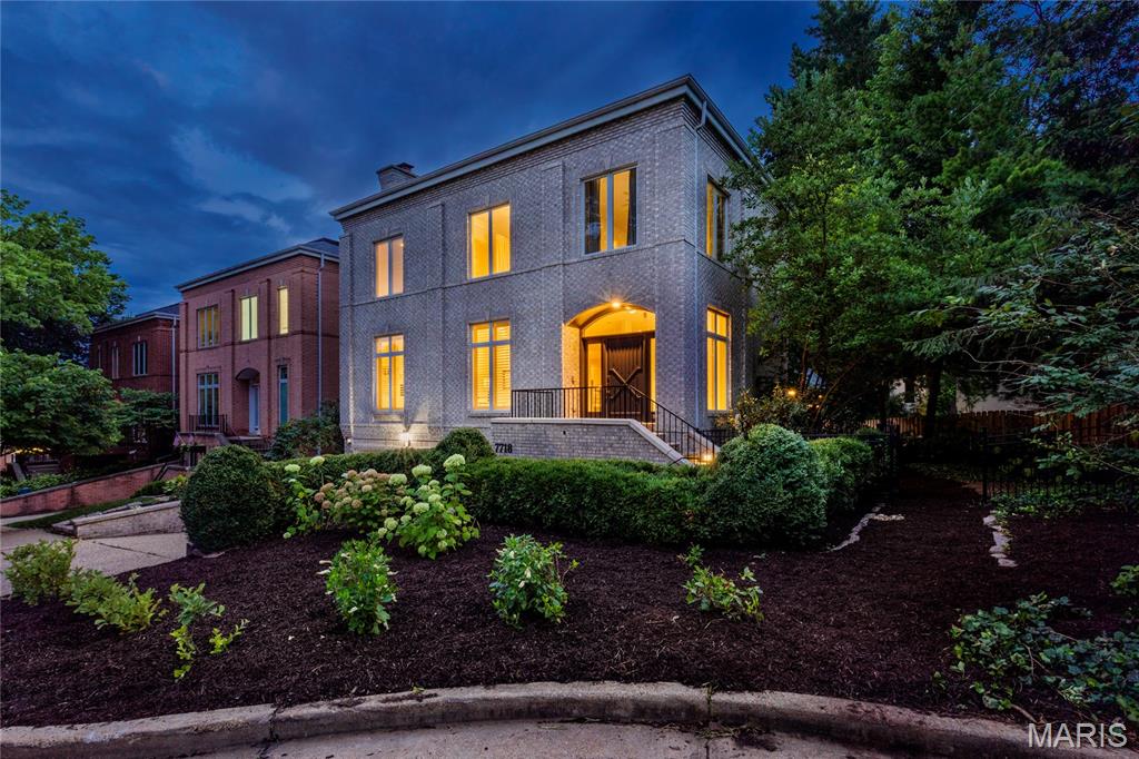 This architecturally significant contemporary townhome rooted in the heart and center of Clayton Missouri presents open concept living at its finest! Replacing old world Clayton architecture with less exterior maintenance and more thought to modern life in the fast lane...3 levels of finished living space present a generous flow to this floor plan that extends to the maintenance free deck, gardens and 2 car garage. Walkability, convenience and common sense engineering's paths rarely cross...but in this exemplary example of an architect's vision you'll find tons of opportunities for peaceful living or abundant entertaining. Choose from cozy at home cooking to rambunctious holiday gatherings or treating your tribe to seated formal dining OR "game day" in the 400 sf lower level family room! Enter through the arched entry into the marble tiled foyer which spans to a generous hearth room with a smoked ember glass fireplace and generous built-ins for your library or collections. Follow the flow from living room and entry foyer back through the dining room into the cook's kitchen and its two adjoining casual rooms with tons of natural light and custom built cabinetry. Your resident chef won't be disappointed with stunning abundant storage, artistic granite counters, a Wolf Range plus no less consequential, the customary wine rack and beverage fridge/wine cooler. Through the convenient breakfast room you can step outside onto an expansive maintenance free deck shaded by trees, perennials and the home's soaring brick facade. Lazy afternoons in the shade with a beverage and a good book await you or a strategically placed lounger in the sun...your choice. A newly carpeted stairway or the wood paneled elevator will take you to the second level which includes the primary ensuite and two more en-suites. The primary bedroom features elegant tray ceilings and a generous wall of built-ins for hidden storage or display. "Mine and Yours" walk-in boutique display custom closets with everything you could ever want includes an adjacent dedicated bedroom level laundry suite. The primary master bathroom is a virtual whirlwind of spa and space...exquisite tiled surfaces, heated floors, multiple spray shower, luxury towel warmers, live edge granite...again with the "Mine and Yours" twin vanities. On the lower walk out level of this elegant city manse you'll find unlimited choices for the finished living spaces... another full bath and tons of utility and storage options. Ready and waiting for you and your entourage. 7718 Walinca Terrace offers a fresh new vision of "Home Sweet Home".