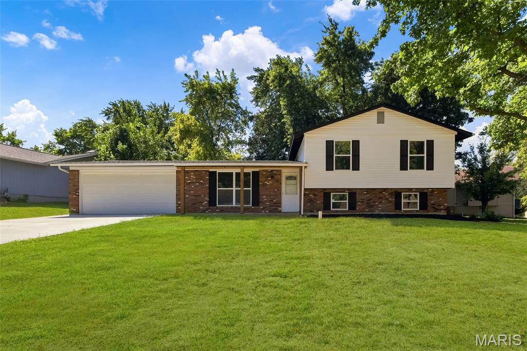 Completely renovated and given new life from top to bottom, this move-in-ready home offers the feel of a fresh start with extensive updates inside and out. The exterior has been transformed with new siding, new windows, a new roof with all-new sheathing, a new driveway and new patio, creating strong curb appeal and eliminating many of the big-ticket projects buyers often worry about.

Inside, you’ll find new flooring, fresh paint, updated lighting and modern finishes throughout. The all-new kitchen features white shaker-style cabinetry, butcher block countertops, stainless steel appliances and a clean, functional design that flows naturally into the living areas.

Both full bathrooms on the main level have been completely updated, and an additional full bathroom was added on the lower level, bringing the home to three full bathrooms. The finished lower level provides valuable additional living space that can be used for entertaining, recreation, a home office, guest area or a combination of uses.

The renovation went well beyond cosmetic finishes. New drain tile and a new sump pump were installed, and the City of St. Peters recently repaired the sewer lateral line. The HVAC system is approximately six years old and has a new fan motor. New Electrical Panel!

The fireplace provides a great architectural focal point and is for decorative purposes only; it is not operational.

From the roof, siding, windows, driveway and patio to the kitchen, bathrooms, lower level and drainage improvements, this home has been thoughtfully updated with both appearance and function in mind. A tremendous amount of work has gone into giving this home a whole new life—ready for its next owner to move in and enjoy.