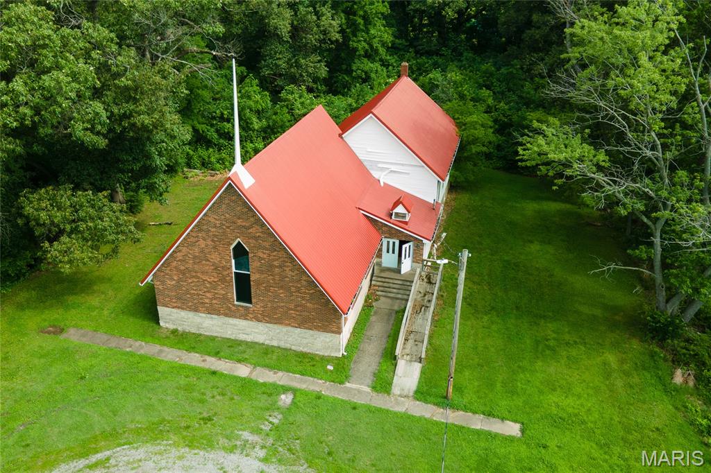 For Sale: Restitution Church of God – 270 Alexander St, Eldorado, ILDiscover a rare opportunity to own this versatile former church property in the heart of Eldorado, Illinois. Ideally situated on a peaceful, wooded lot, this unique building offers endless potential for conversion into a spacious private residence, rental property, creative studio, event venue, or mixed-use space—whatever fits your vision.Property Highlights:Spacious Layout: Features three levels, two bathrooms, and a functional kitchen, providing a solid foundation for residential conversion or custom renovations.
Wooded Setting: Nestled on a serene, tree-lined lot that offers privacy, natural beauty, and a tranquil atmosphere.
Prime Location: Conveniently located in Eldorado, with easy access to outdoor recreation. The property sits close to the stunning Shawnee National Forest, perfect for hiking, camping, and nature lovers. Marion is just a short 42-minute drive away, offering additional amenities, shopping, and services.

This flexible property is a blank canvas ready for your personal touch. Whether you're looking to create a one-of-a-kind home surrounded by nature or explore other creative uses, or start your own church, the Restitution Church of God at 270 Alexander Street presents an exciting and affordable opportunity in a desirable Southern Illinois location.Contact us today for more details, a private showing, or to discuss the many possibilities this property holds!