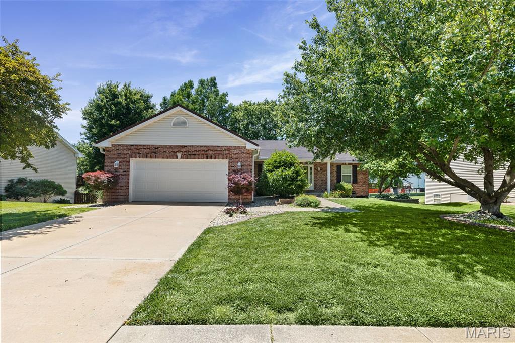 Welcome to this spacious and inviting four-bedroom home. Large windows across the back of the home fill the space with natural light, while the cozy gas fireplace adds warmth and comfort to the living area. The kitchen offers beautiful wood cabinetry, a pantry, and an adjoining dining space designed for everyday living and entertaining. Step outside through the sliding doors onto the elevated deck overlooking the landscaped backyard — an ideal place to enjoy your morning coffee or unwind in the evening.
The primary suite includes dual closets for generous storage and an en-suite bath featuring separate tub and shower areas along with dual vanities.
The finished walk-out basement expands your living space, with built-in cabinetry, a full sink, and room for a mini refrigerator, making it a great setup for entertaining, gatherings, or flexible use making it a great setup for entertaining, gatherings, or flexible use. 
Recent updates include spot painting throughout the home, and the seller is offering a $5,000 credit toward property upgrades, giving buyers the opportunity to personalize the space. The home metal roof, an investment of $90,000 delivering outstanding durability, long-term performance, and exceptional added value. Come enjoy the space, comfort, and possibilities this home has to offer.