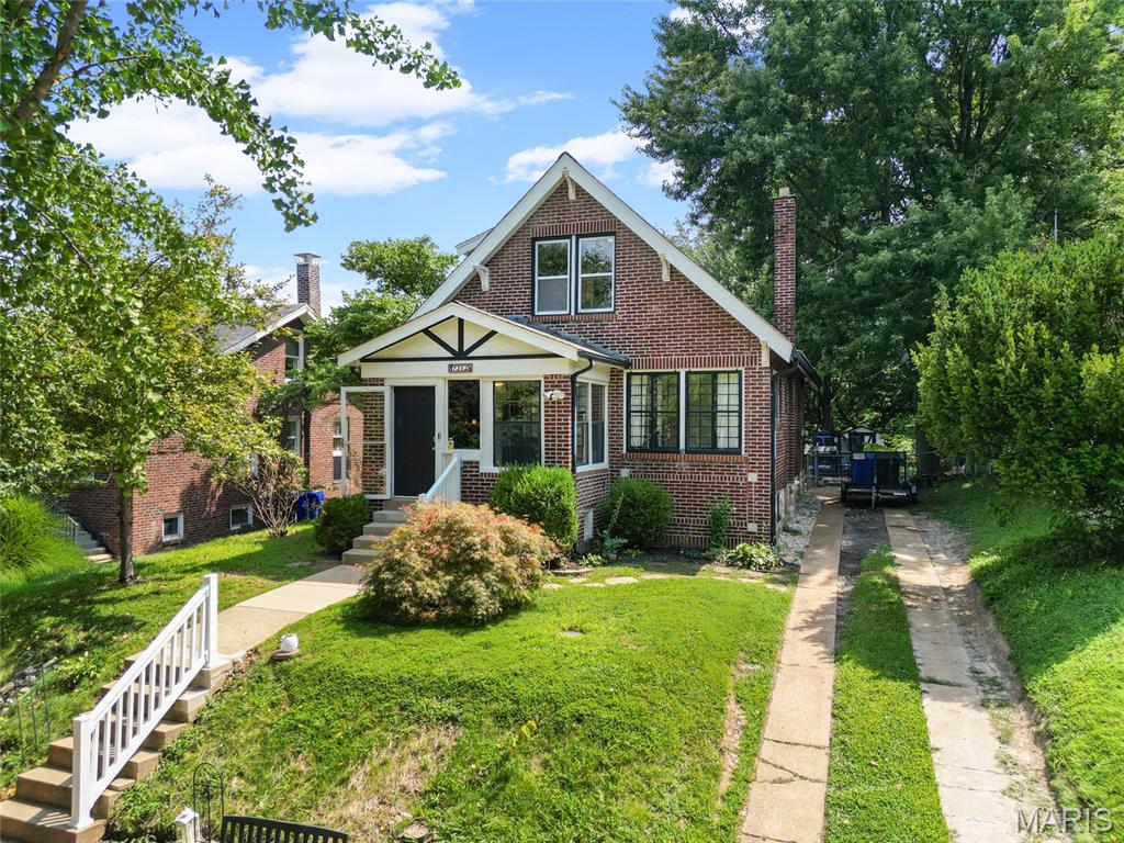 NEW PRICE ALERT!!! Welcome to 7312 Wellington Avenue in University City!

This charming 3-bedroom, 2-bathroom home offers more than 1,200 square feet of living space and is perfectly situated in the heart of University City. Enjoy the convenience of being within walking distance of multiple parks, the University City Recreation Center, and the community pool.

Step inside through the enclosed three-season front porch and into a warm, inviting living room featuring beautiful original stained-glass windows and gleaming hardwood floors. Just off the living room, you'll find a spacious main-floor bedroom with elegant French doors and a large closet.

The dining room flows seamlessly into the updated kitchen, creating an ideal layout for everyday living and entertaining. A full bathroom is conveniently located on the main level, while the adjoining bonus room offers endless possibilities as a home office, playroom, family room, or flex space. Cozy up on chilly winter evenings beside the ventless gas fireplace, making this room a favorite gathering spot year-round.

Upstairs, you'll find two generously sized bedrooms and a beautifully updated full bathroom featuring brand-new tile throughout.

This home also offers peace of mind with numerous major updates, including: Tankless water heater,  New copper plumbing throughout, Two HVAC systems, with separate units serving the main floor and upper level and a brand-new sewer lateral line with no lead pipes

Location is everything, and this home delivers! You're just minutes from Dierbergs, Target, Olive Boulevard, Interstate 170, and many of the area's best shopping, dining, and everyday conveniences.

As an added bonus, this property is located within an area eligible for the Washington University and BJC Live Near Your Work Program, which may provide qualifying employees with forgivable down payment and closing cost assistance.

Don't miss your opportunity to own this beautiful University City home. Schedule your private showing today—this one won't last long!
