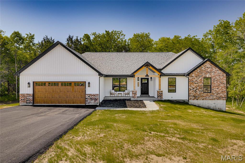 Looking for a 4 bed, 2 bath home in the Farmington School District? Congratulations, you just found it.

With over 2,100 sq ft of living space plus an unfinished walk-out basement, there is plenty of room to spread out now and even more potential for later. The basement is already roughed in for a bathroom, so you can finish it when you’re feeling ambitious.

Sitting on 3 level acres, you get space to breathe while still being just minutes from town. Best of both worlds without the long gravel road commitment.

Inside, the open floor plan is made for real life and entertaining, featuring quartz countertops, a large island, walk-in pantry, and a built-in pot filler because carrying heavy pots is overrated. Custom lighting, coffered ceilings, and black tinted windows bring all the modern farmhouse vibes.

The split bedroom layout gives everyone their own space, with three bedrooms and a full bath on one side and a private primary suite on the other. The primary bathroom really delivers with TWO separate vanities, each with its own sink, lighting, and mirror, so no one is fighting for counter space. You also get a soaking tub, separate shower, and two walk-in closets, because sharing is overrated.

You’ll also find a laundry room with cabinet storage and a utility sink, plus an attached 2-car garage to keep life convenient.

Four bedrooms, over 3 acres, and room to grow… this one is not going to sit around waiting forever.
