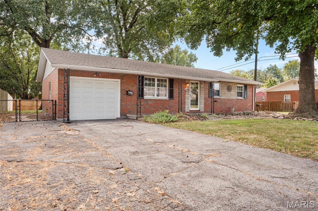 Charming all-brick, one-story home offering 3 bedrooms and 1 & 1/2 baths. Enjoy morning coffee on the covered front porch or unwind on the covered back patio overlooking the spacious privacy-fenced backyard.  Spacious living room & dining room area. All appliances staying in kitchen. Large coat closet in foyer. Primary Bedroom suite has half bath. The finished basement provides additional living space with a spacious family room, bonus room that could potentially serve as a non-conforming bedroom, plus unfinished space for storage. One car attached garage with a double wide driveway for plenty of parking. Just blocks away from one of the most impressive parks around, Wilson Park - offering easy access to green space and recreation. More updates include Furnace (2019), A/C (2019), Hot Water Heater (2019), Roof (2014). A great opportunity to make this well-maintained brick home your own!
