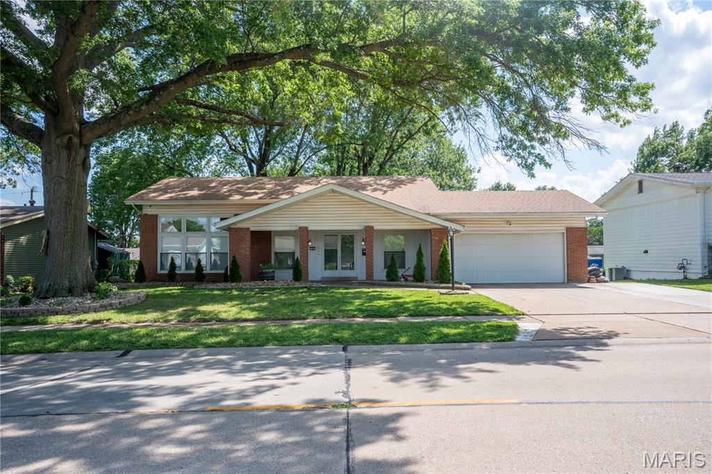 Nestled in a quaint, established neighborhood, this beautifully maintained 4-bedroom, 2.5 bath tri-level home offers the perfect blend of comfort and functionality. The 1,826sqft of open living space, thoughtful updates, and peaceful setting makes this is a home you’ll be proud to call your own. Upon arrival you’ll appreciate the large front porch, newer landscaping and widened driveway leading to your oversized 2 car garage. Inside, the welcoming open floorplan creates a natural flow between living spaces while updated kitchen boasting quartz countertops serves as the heart of the home. Other improvements include a newer roof, HVAC system, and water heater, peace of mind and added value for years to come. Required occupancy inspection PASSED, allowing buyers to move forward with confidence. The outdoor space offers multiple spaces to relax and make lasting memories under the shade of the mature trees. Come see this move-in ready Hazelwood gem where pride of ownership sets this property apart.
