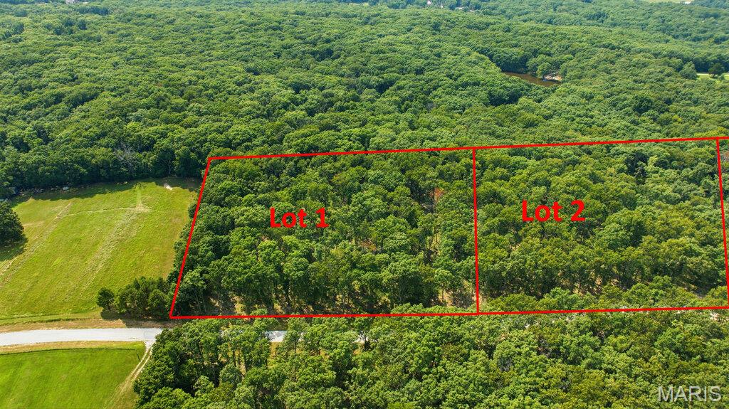 5 Beautiful, wooded acres located just minutes from I-70 and conveniently situated just off blacktop frontage. This peaceful property offers the perfect setting to build your dream home or barndominium while enjoying privacy, nature, and easy access to nearby amenities. Lots range from approximately 3 to 5 acres and are subject to minimal restrictions. No mobile or modular homes, junkyards, or hog farms are permitted. Cuivre River Electric will be available upon completion of engineering and installation by the developer. Each lot will require a private well and septic system.